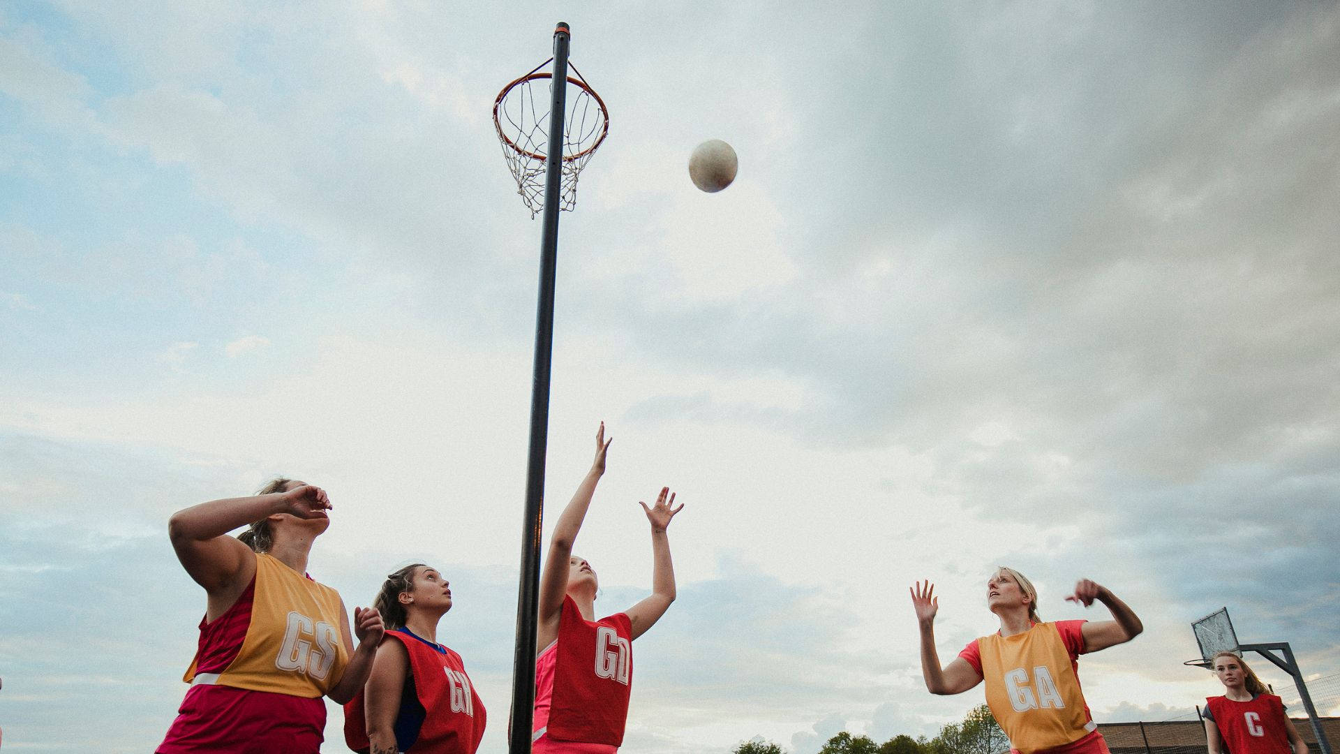 Students Playing Outdoor Netball Catch Ball