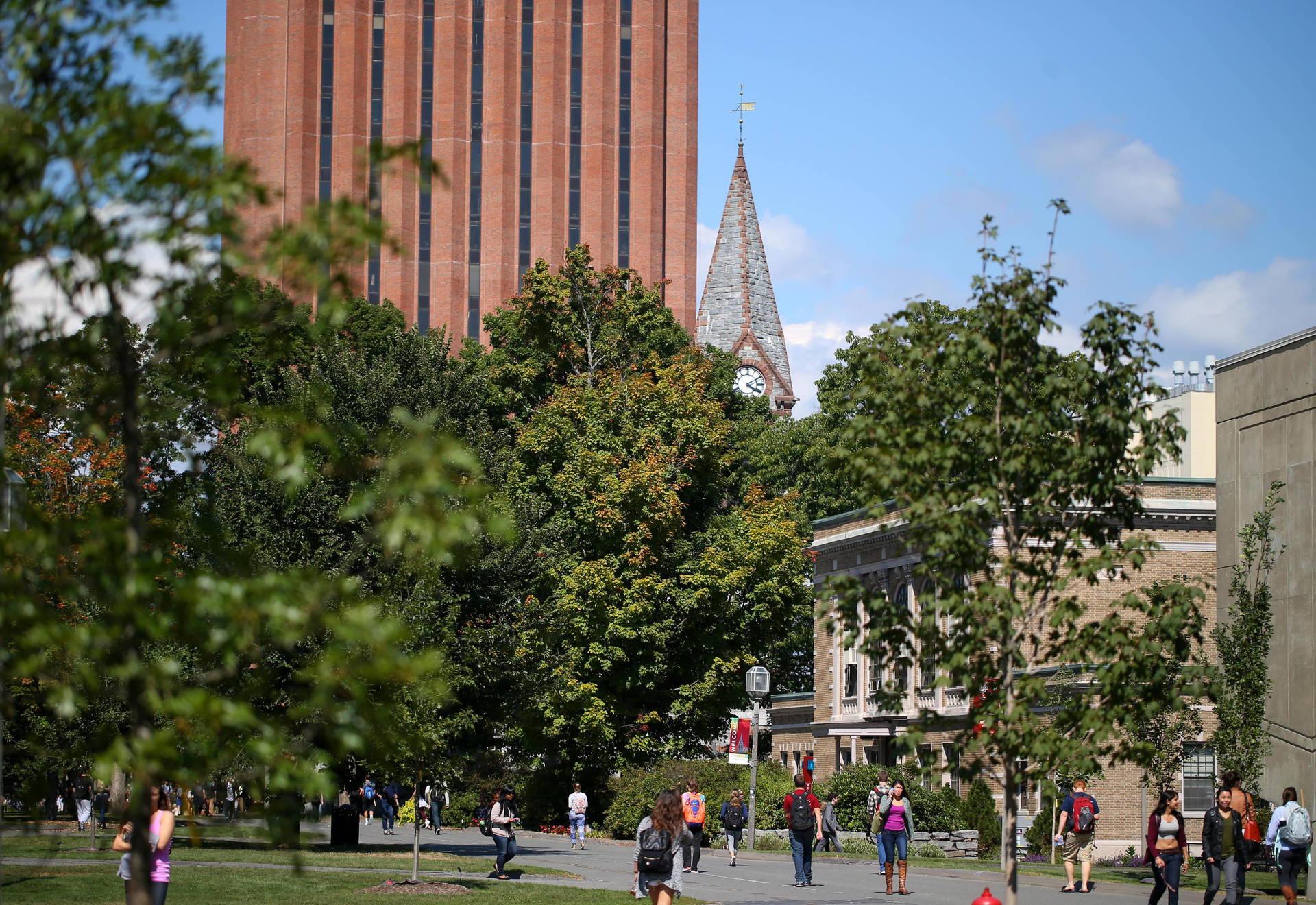 Students Strolling Across The University Of Massachusetts Campus Background