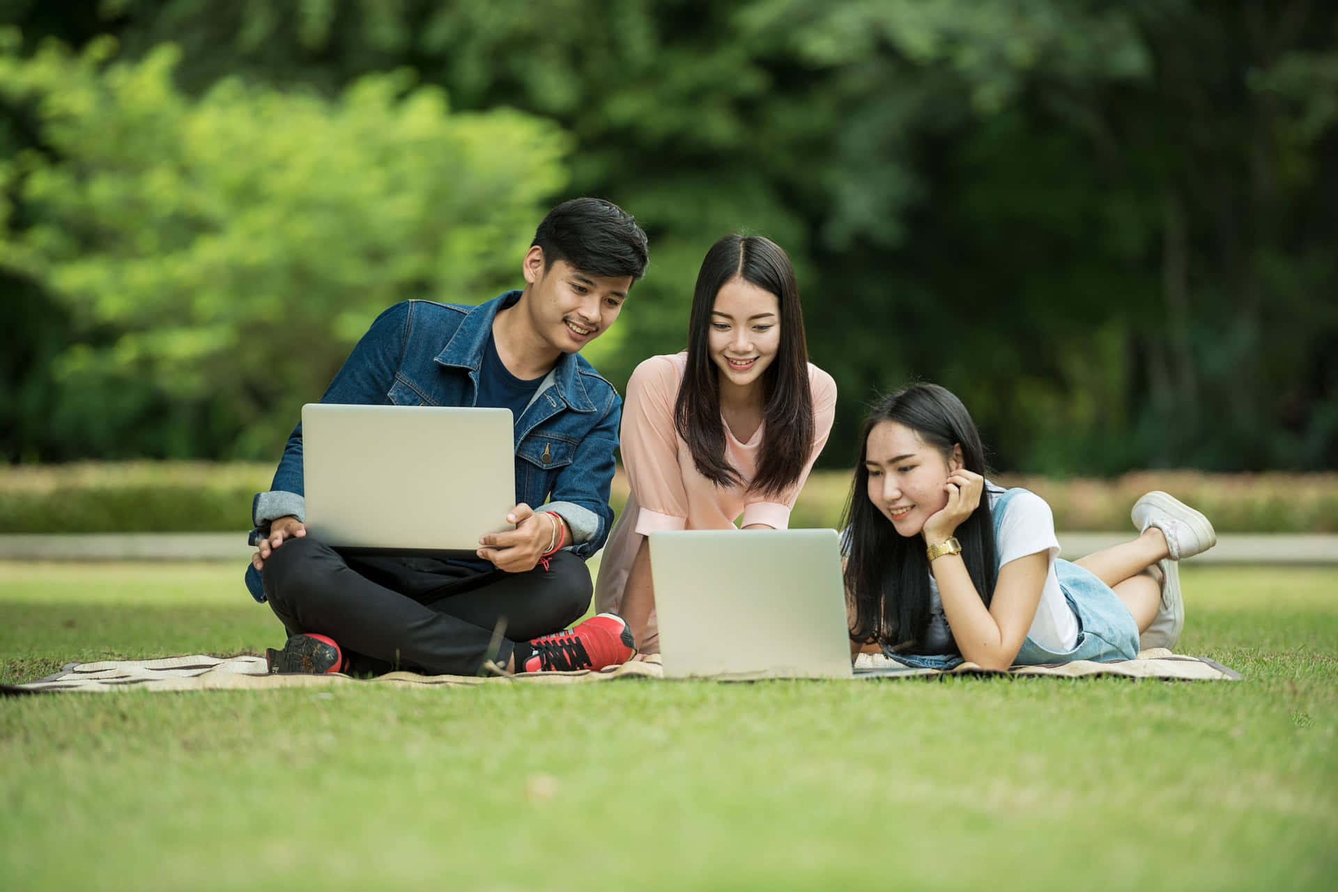 Students Studying Outdoors With Laptops.jpg Background