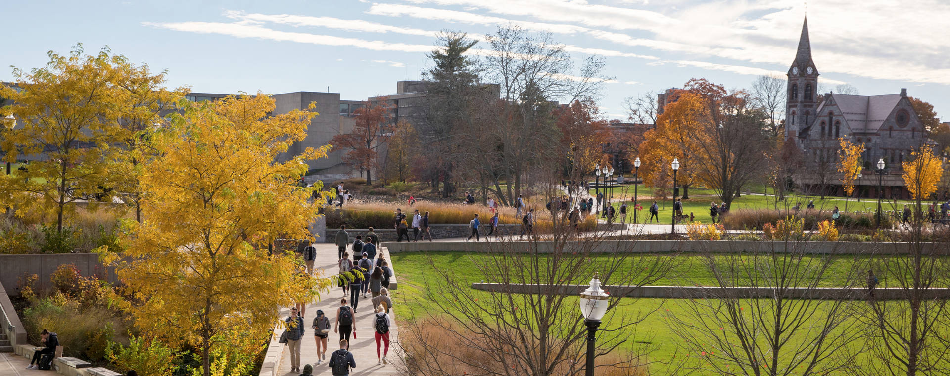 Students Walking On A Pathway At University Of Massachusetts Background