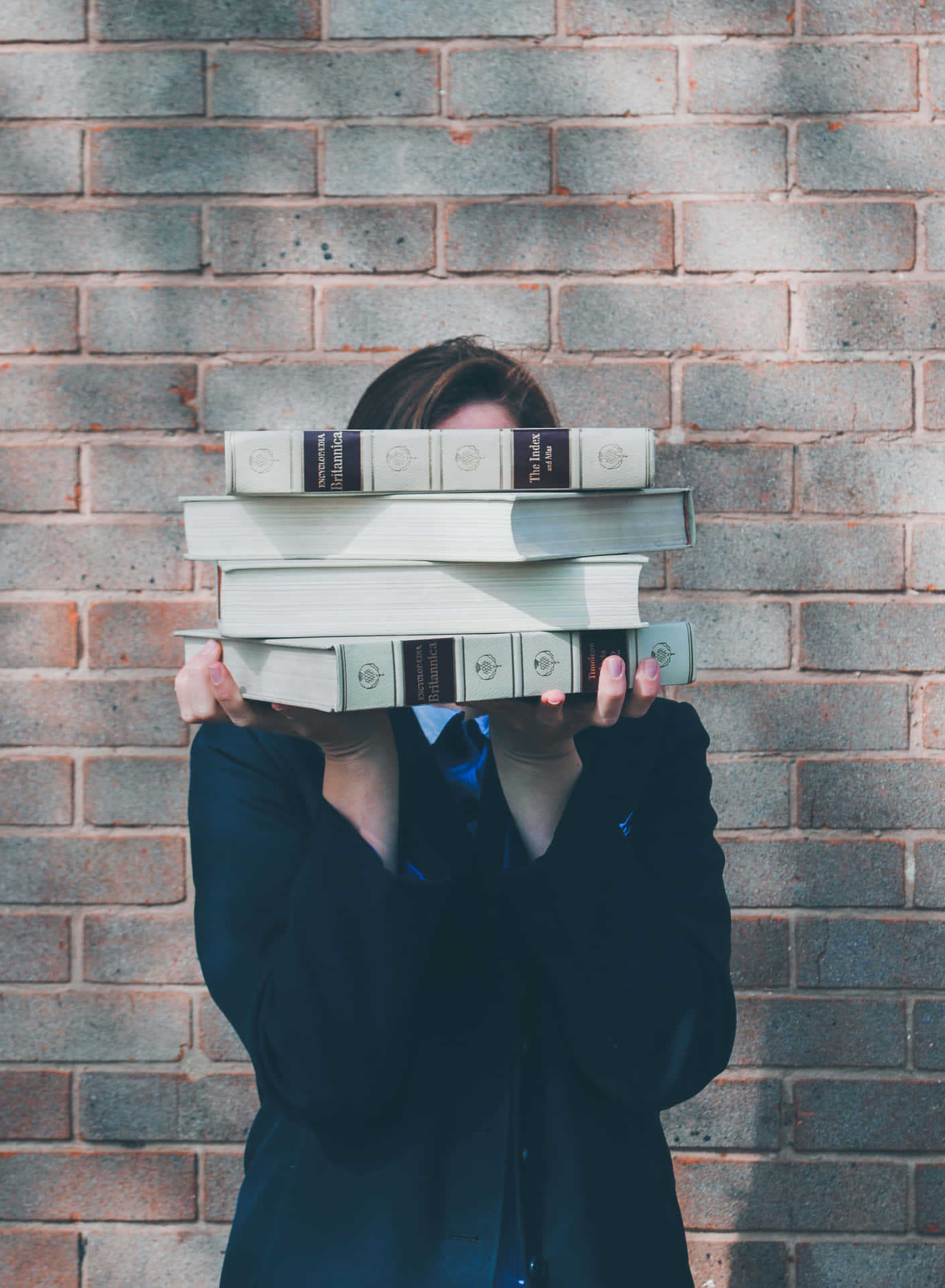 Studious Woman Holding Books Background