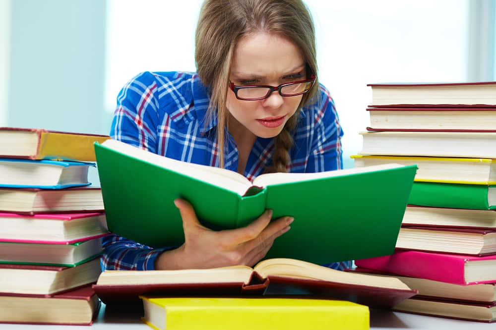 Studious Woman Surrounded By Books Background