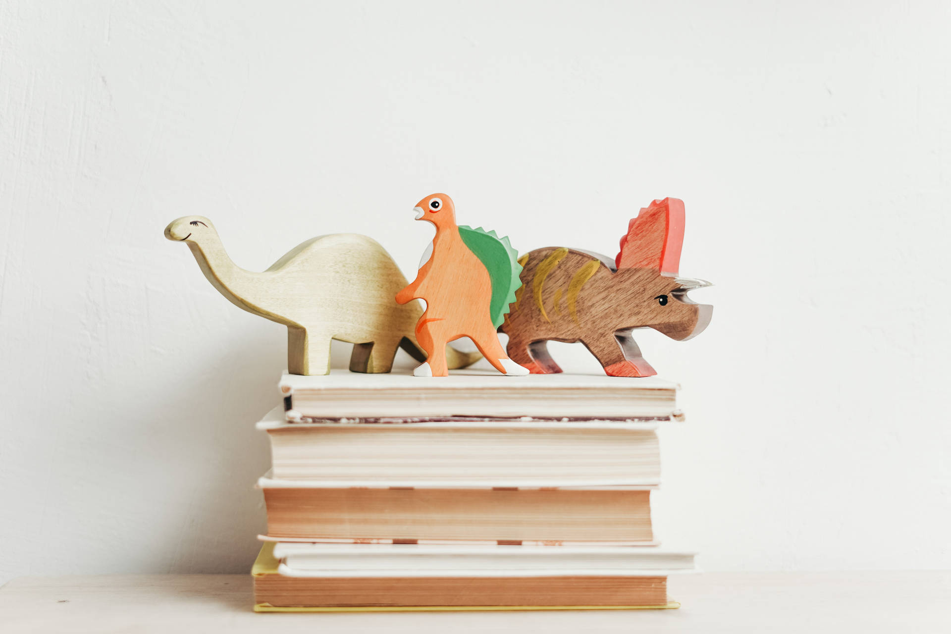 Study Motivation Dinosaur Figurines On Books Background