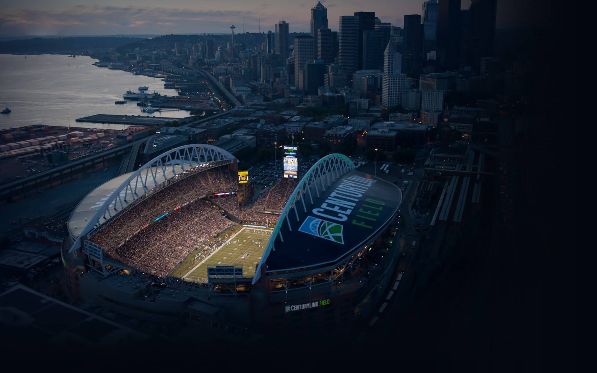 Stunning Aerial View Of A Grand Stadium In Seattle Background