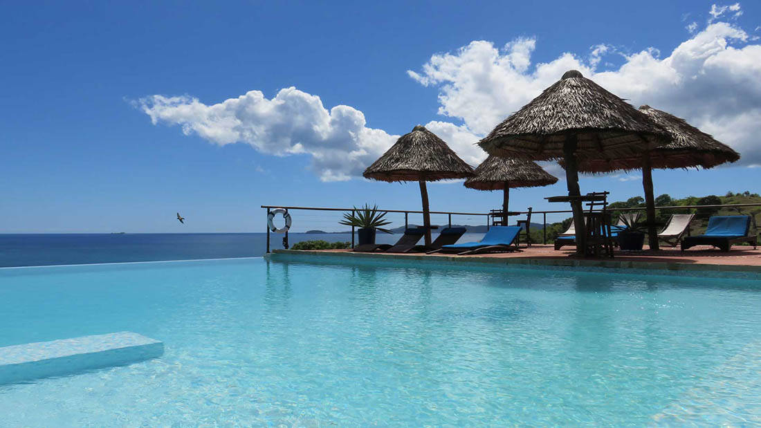 Stunning Beach Cabanas In Madagascar Background