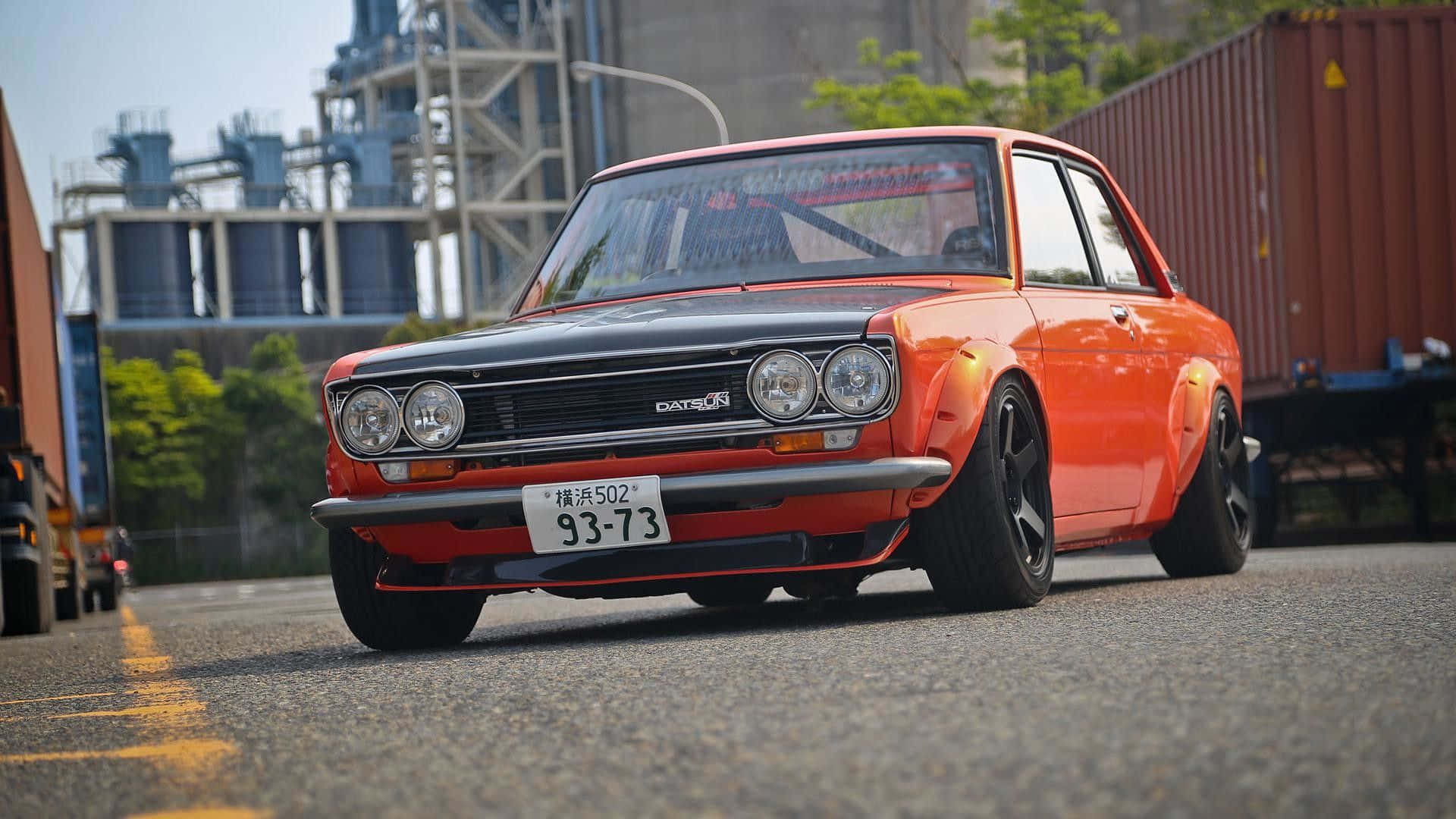 Stunning Datsun Car On The Road Background