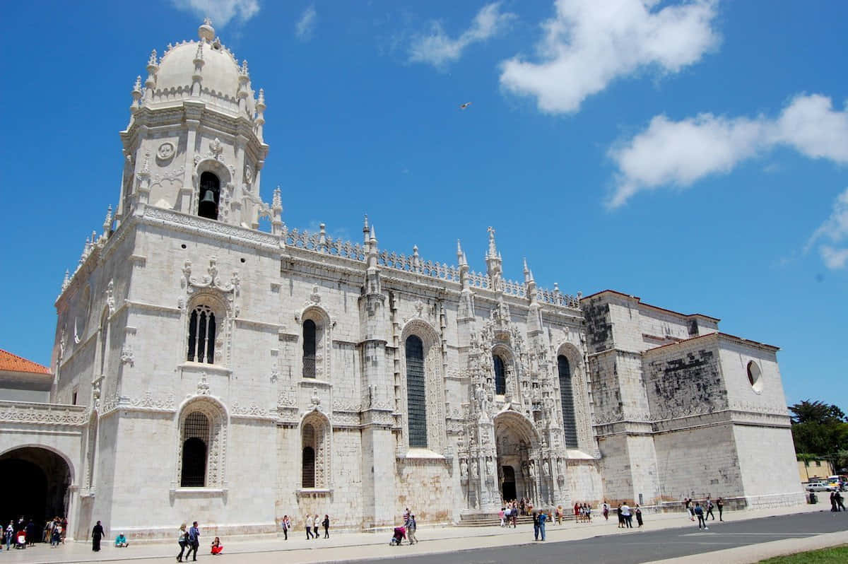 Stunning Left-angle Capture Of Mosteiro Dos Jeronimos, Lisbon Background