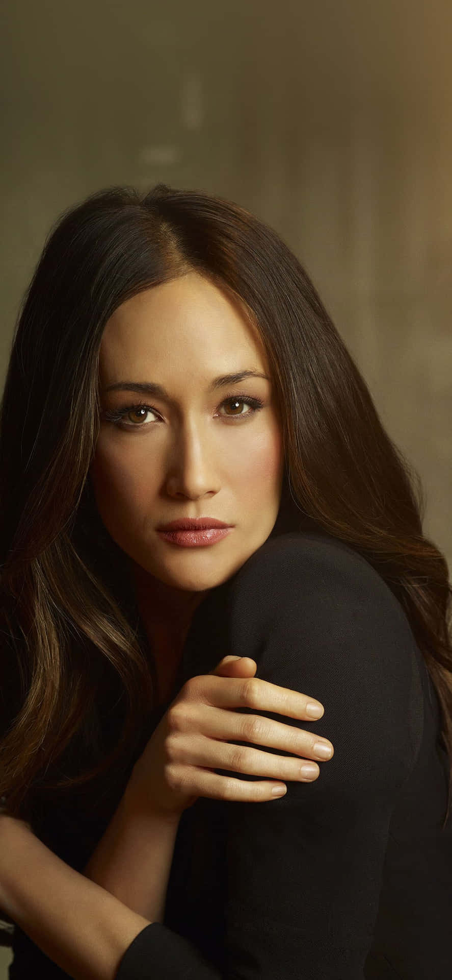 Stunning Maggie Q Posing Elegantly Background