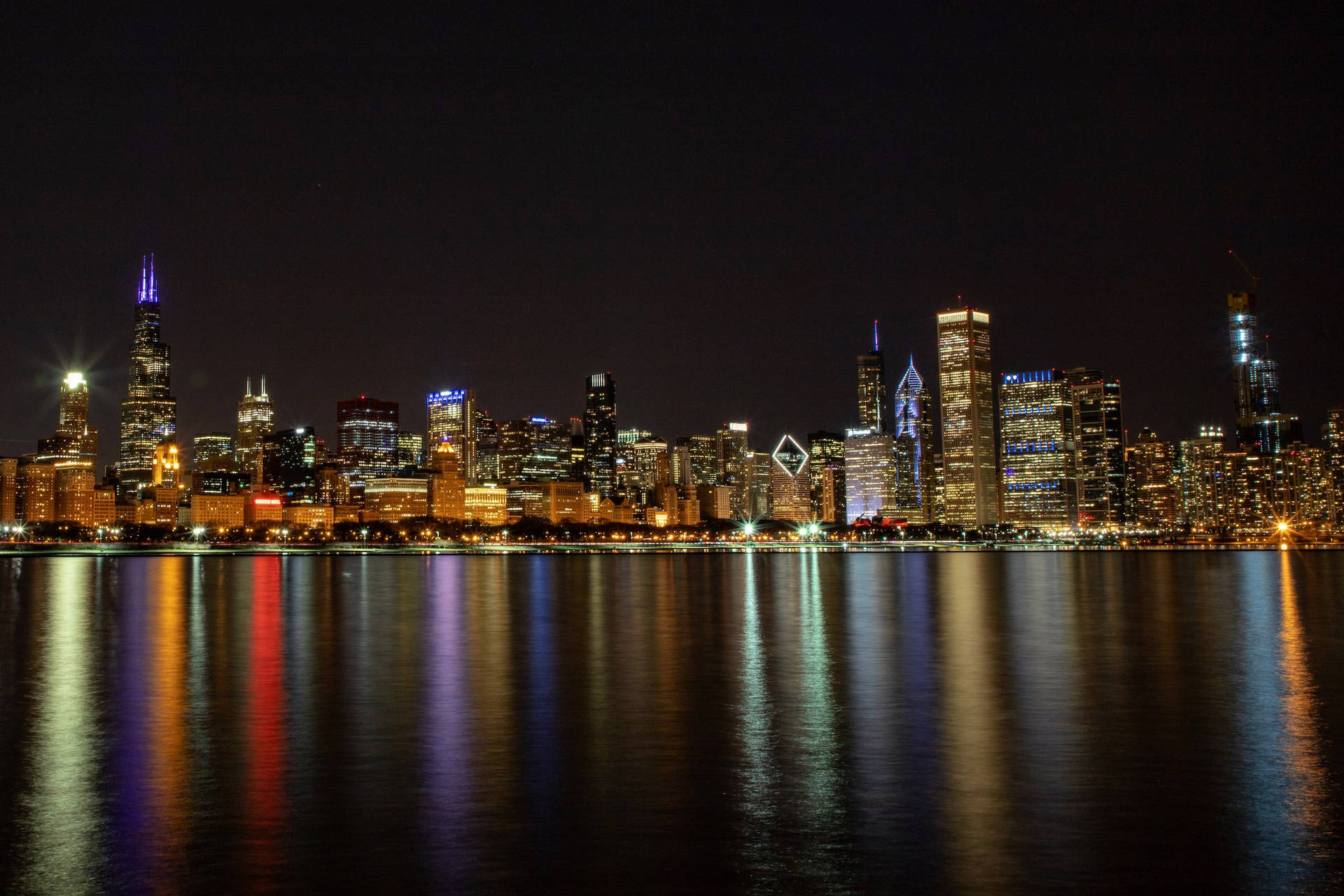 Stunning Midnight View Of The Chicago Skyline Background