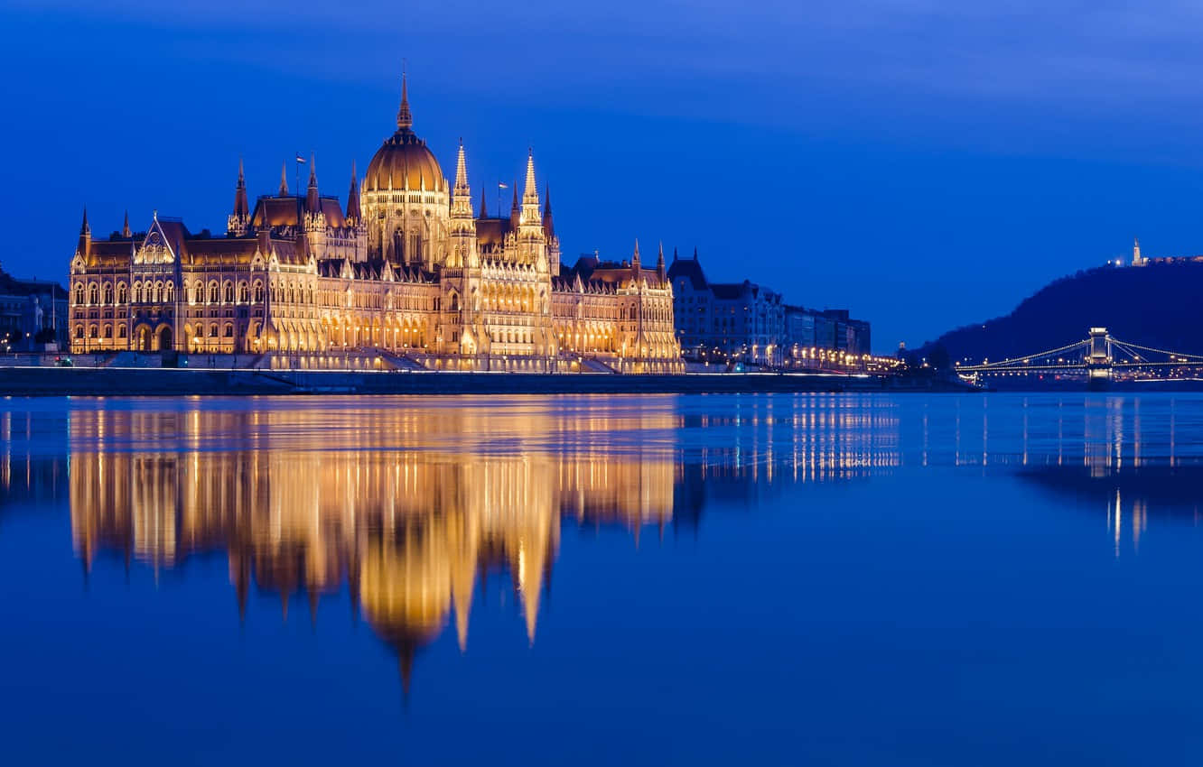 Stunning Night Reflection Of The Hungarian Parliament Buildings Background