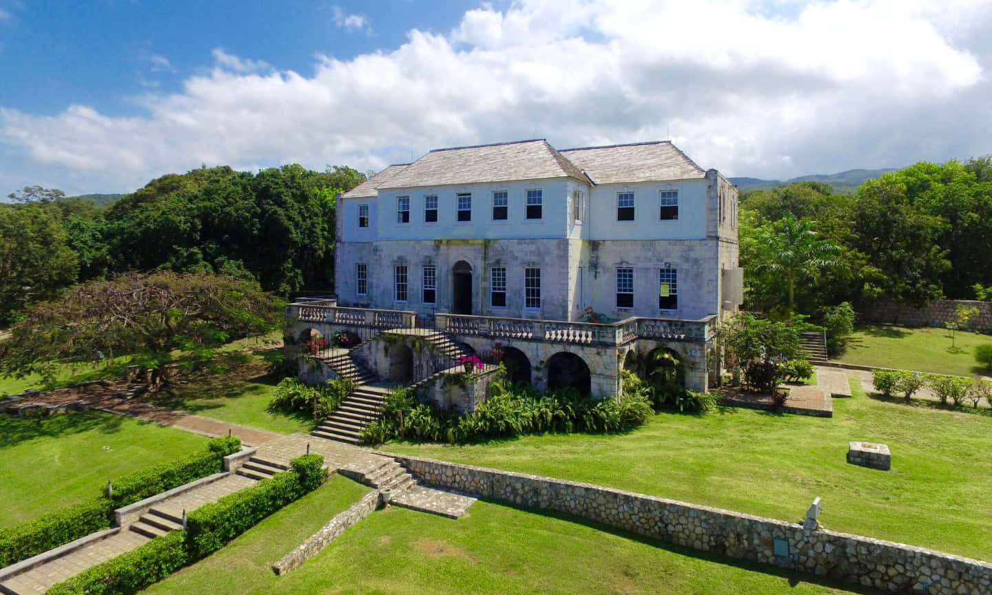 Stunning Overview Of Rose Hall Great House And Surrounding Scenery Background
