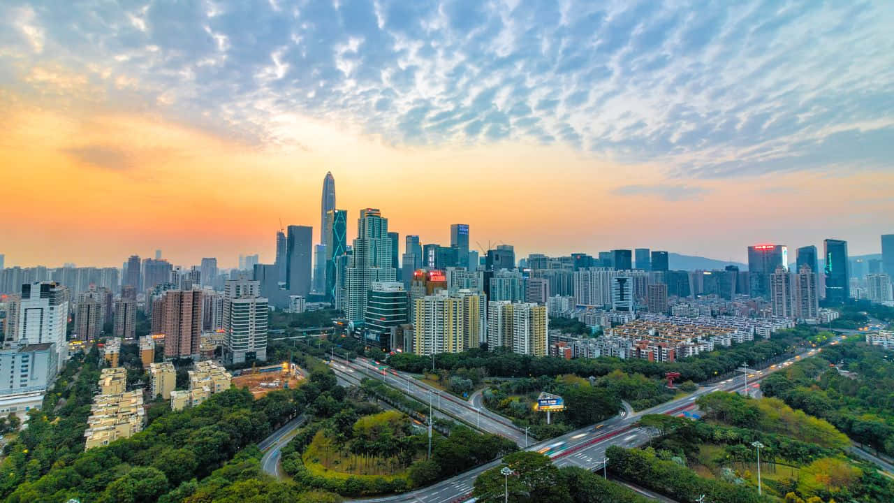 Stunning Purple Sunset Over A Tranquil Ocean Background