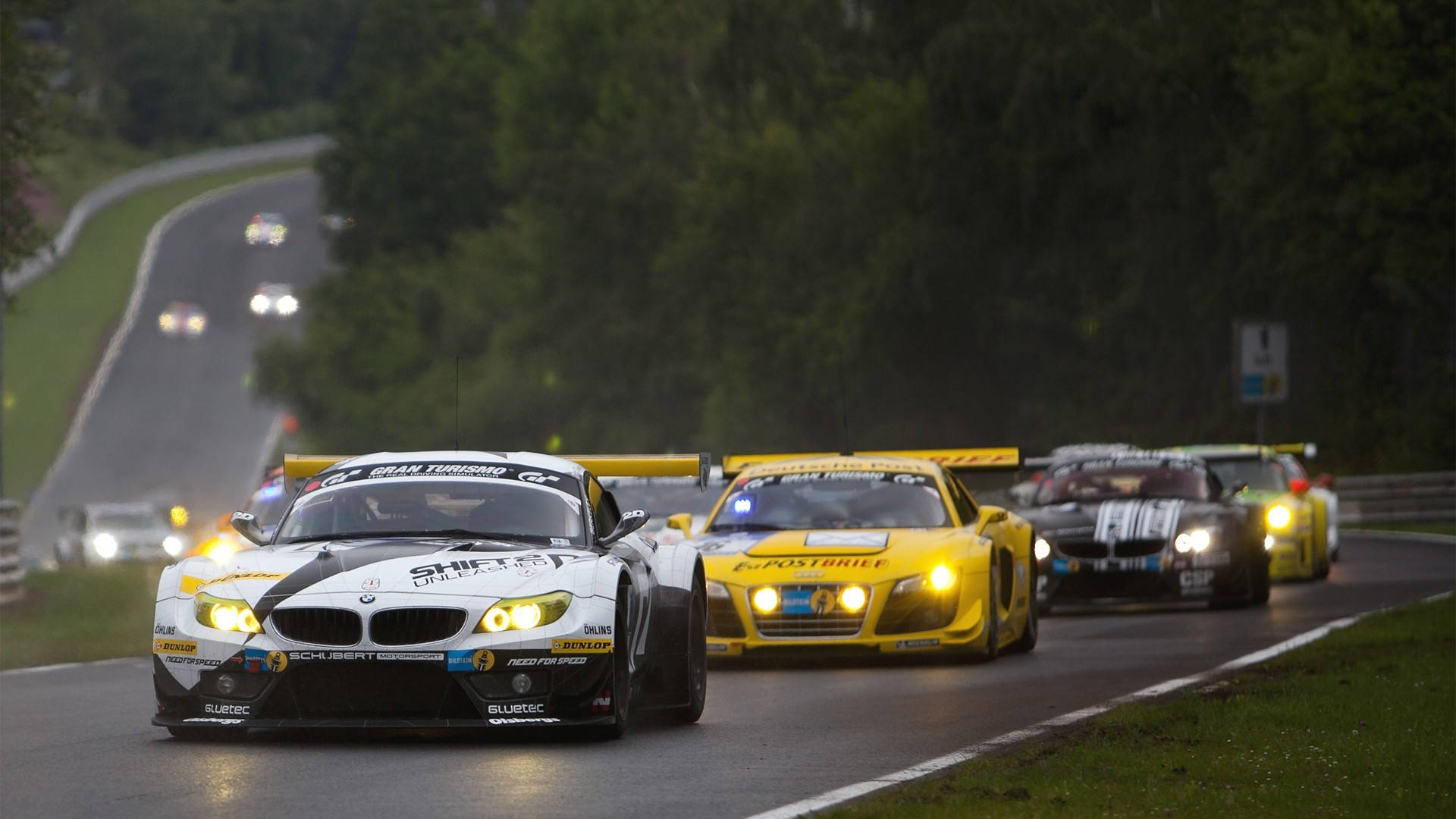 Stunning Sports Cars In Thrilling Race Background