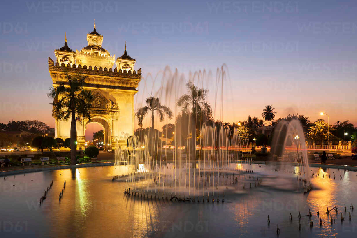 Stunning Sundown View Of Patuxai Monument And Fountain In Vientiane, Laos Background