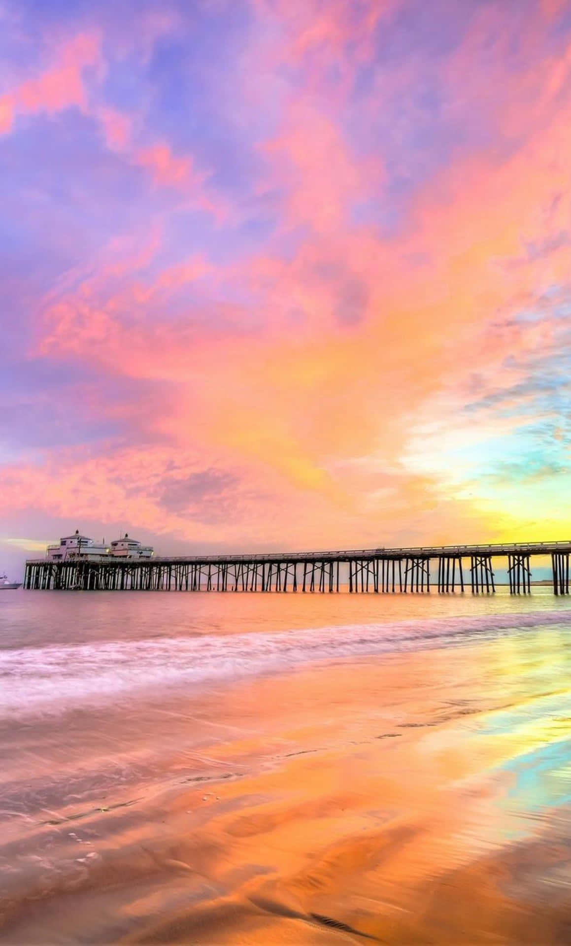 Stunning Sunset Beach Barely Touched By The Sun's Rays Background