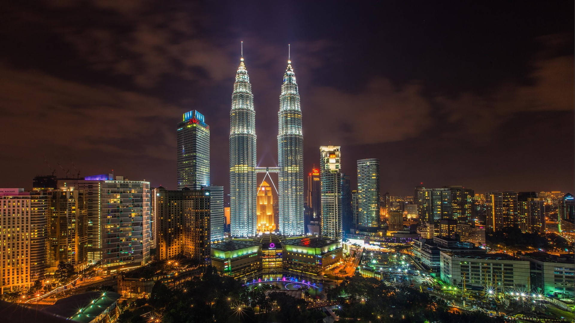 Stunning View Of Petronas Towers At Night, Kuala Lumpur Background