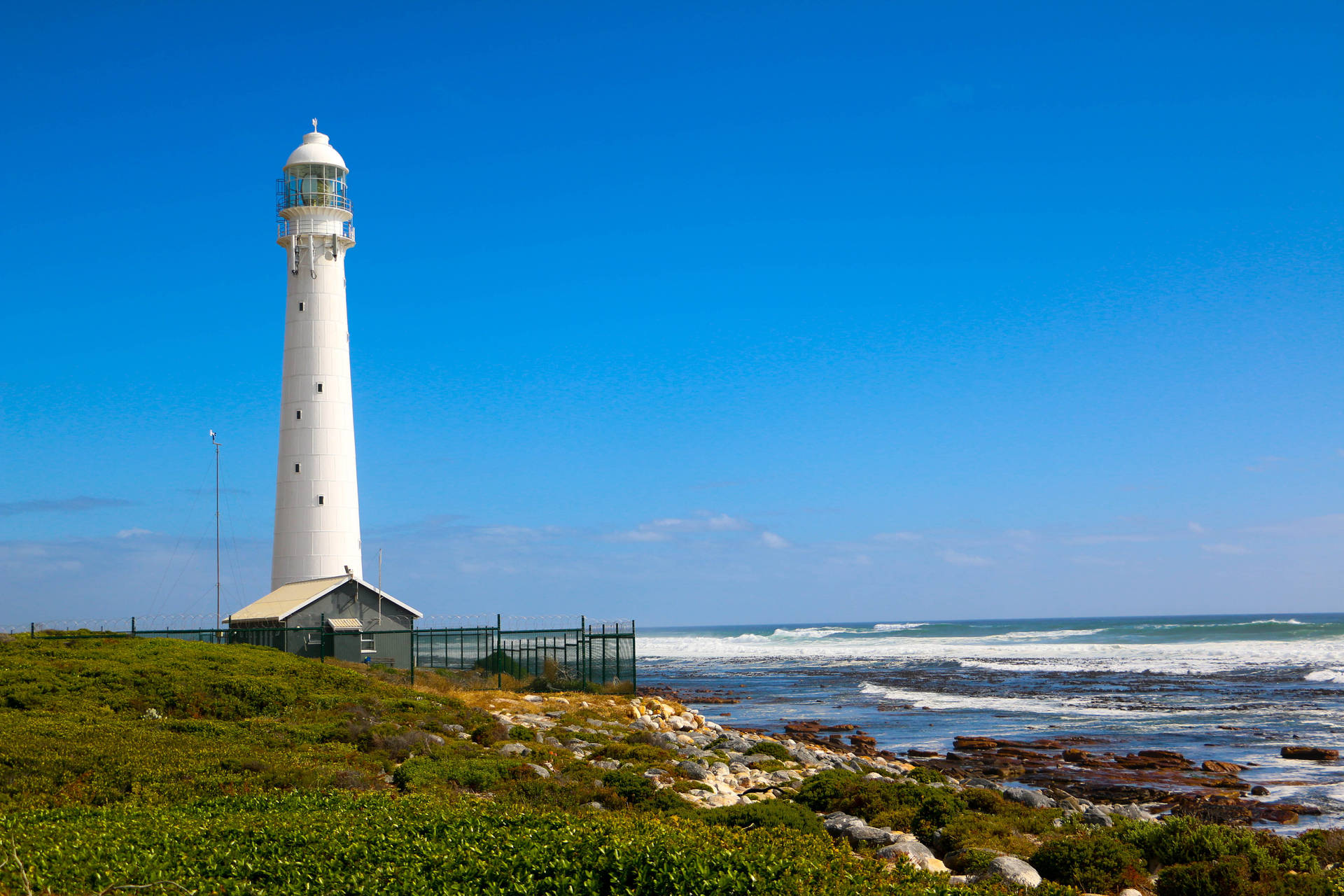 Stunning View Of The Slangkop Lighthouse Illuminating The Twilight Sky, Cape Town Background