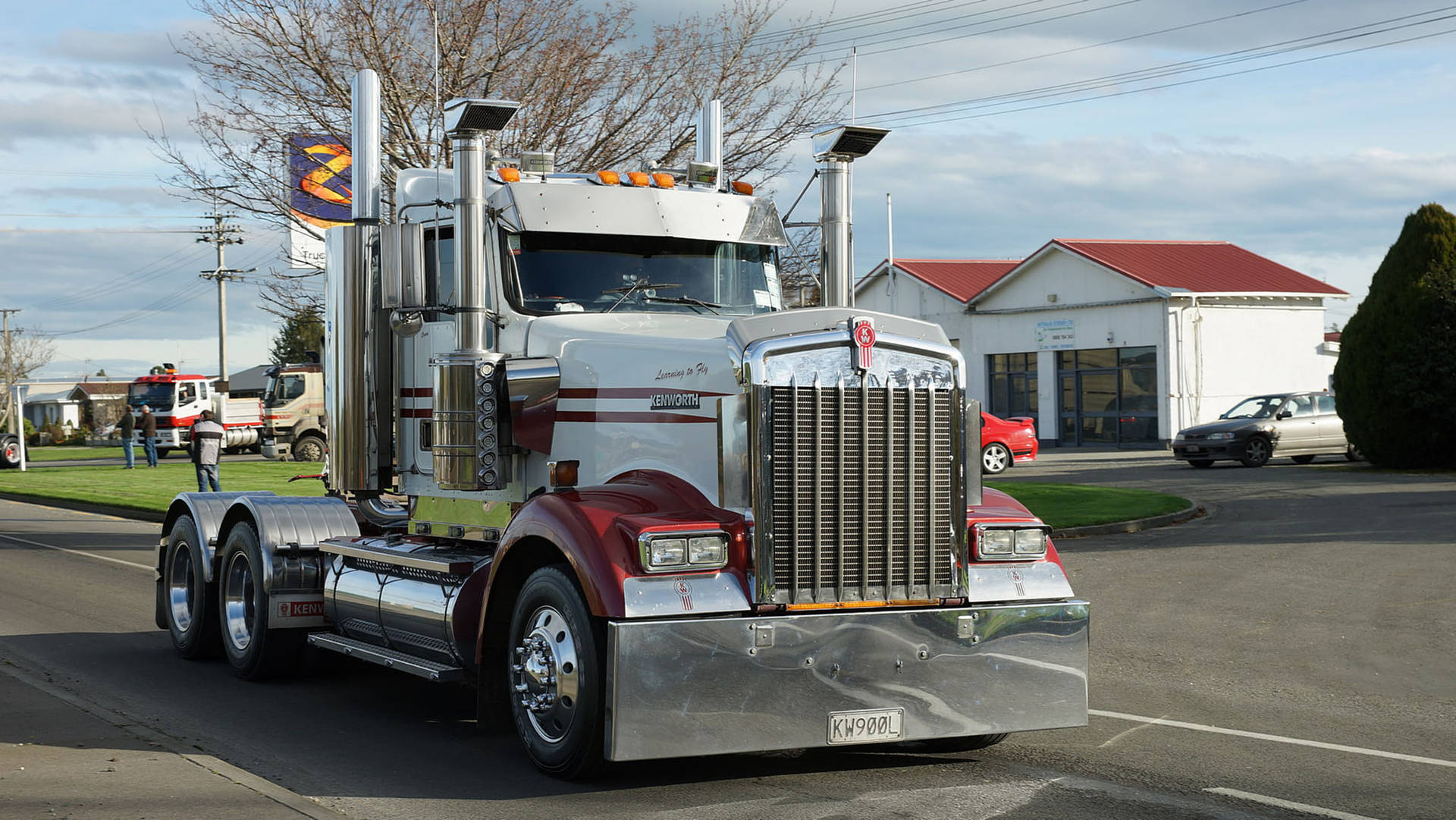Stunning White Kenworth W900 On The Open Road Background