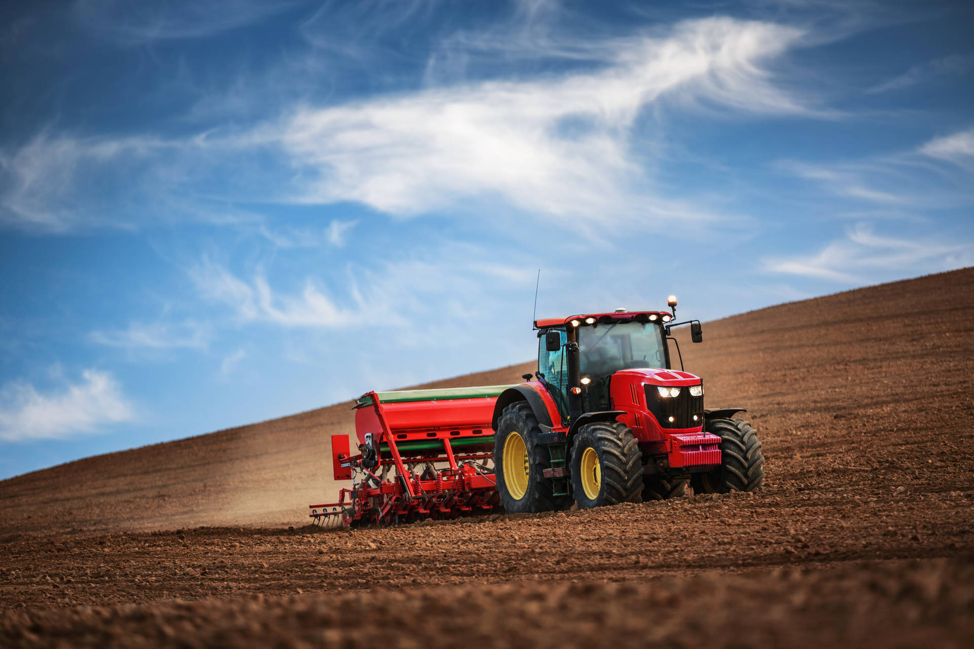 Sturdy Red Tractor On A Farm Field