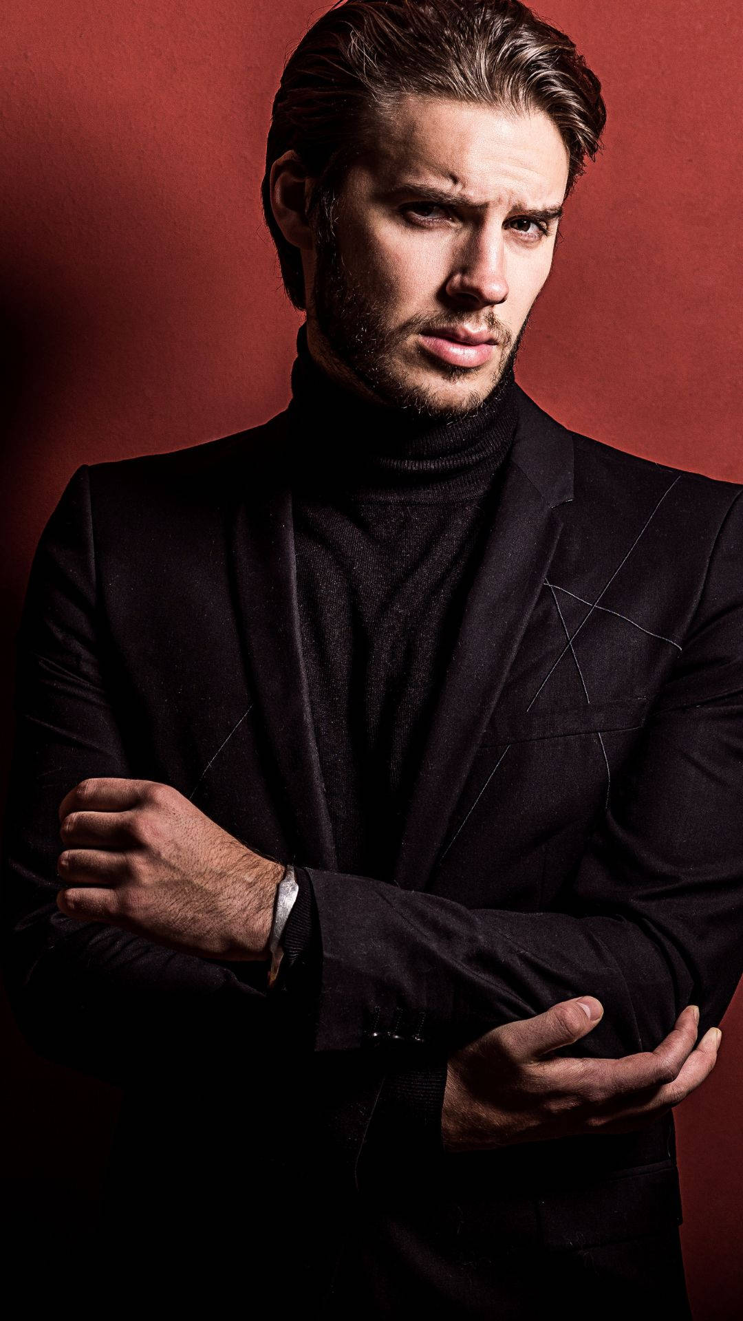 Stylish And Sophisticated - A Dapper Gentleman In An Elegant Black Suit Background