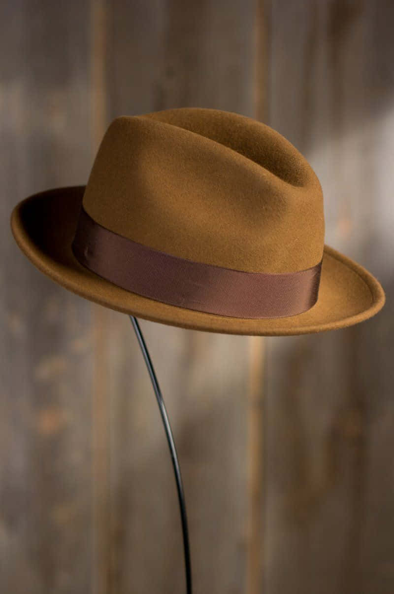 Stylish Black Hat On A Wooden Table Background