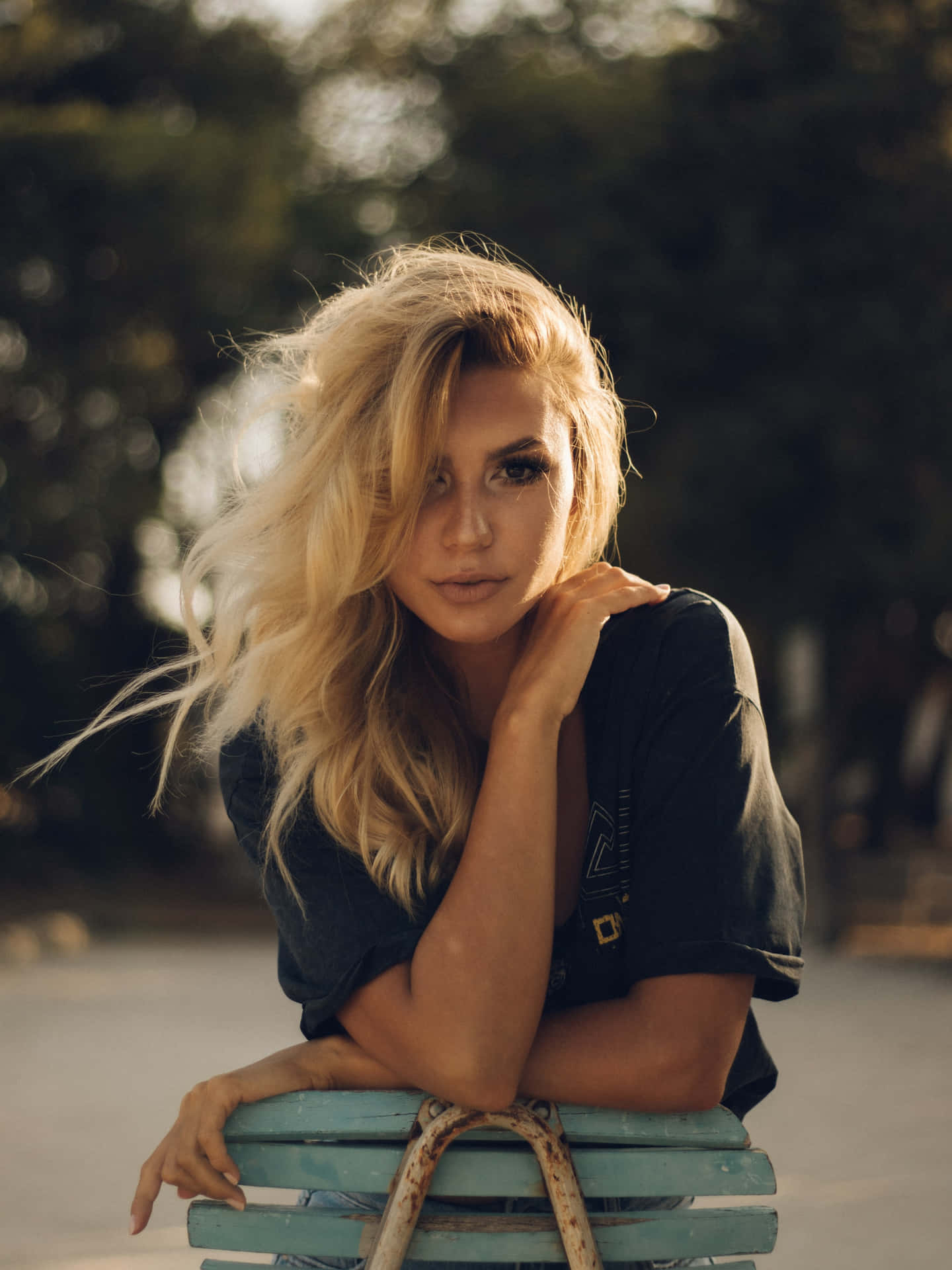 Stylish Blonde: Portrait Of Linda Chica With Tousled Hair Background