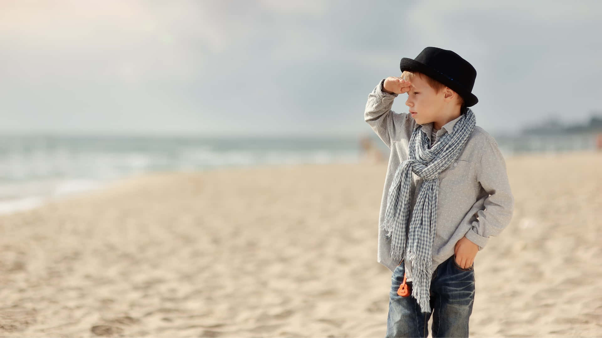 Stylish Boy At The Beach Background