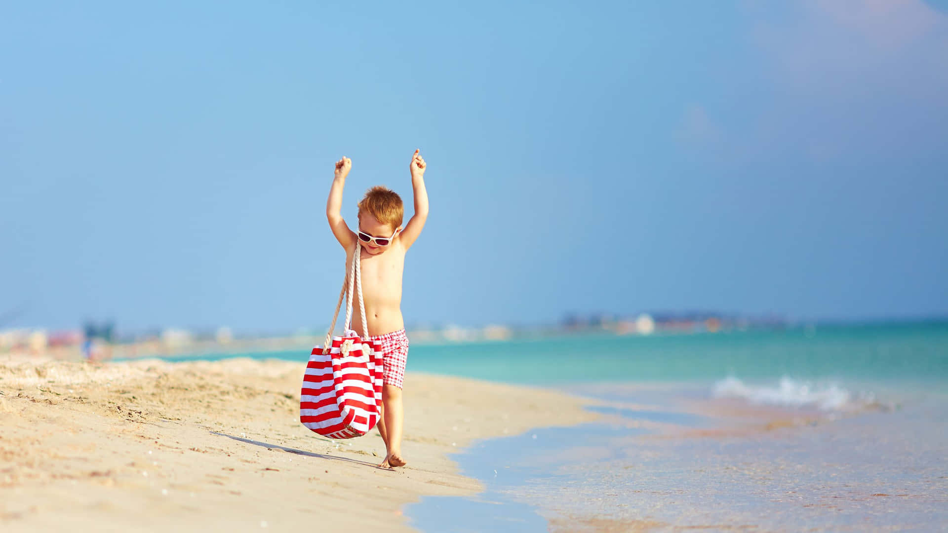 Stylish Boy Enjoying A Day At The Beach In A Trendy Summer Outfit Background