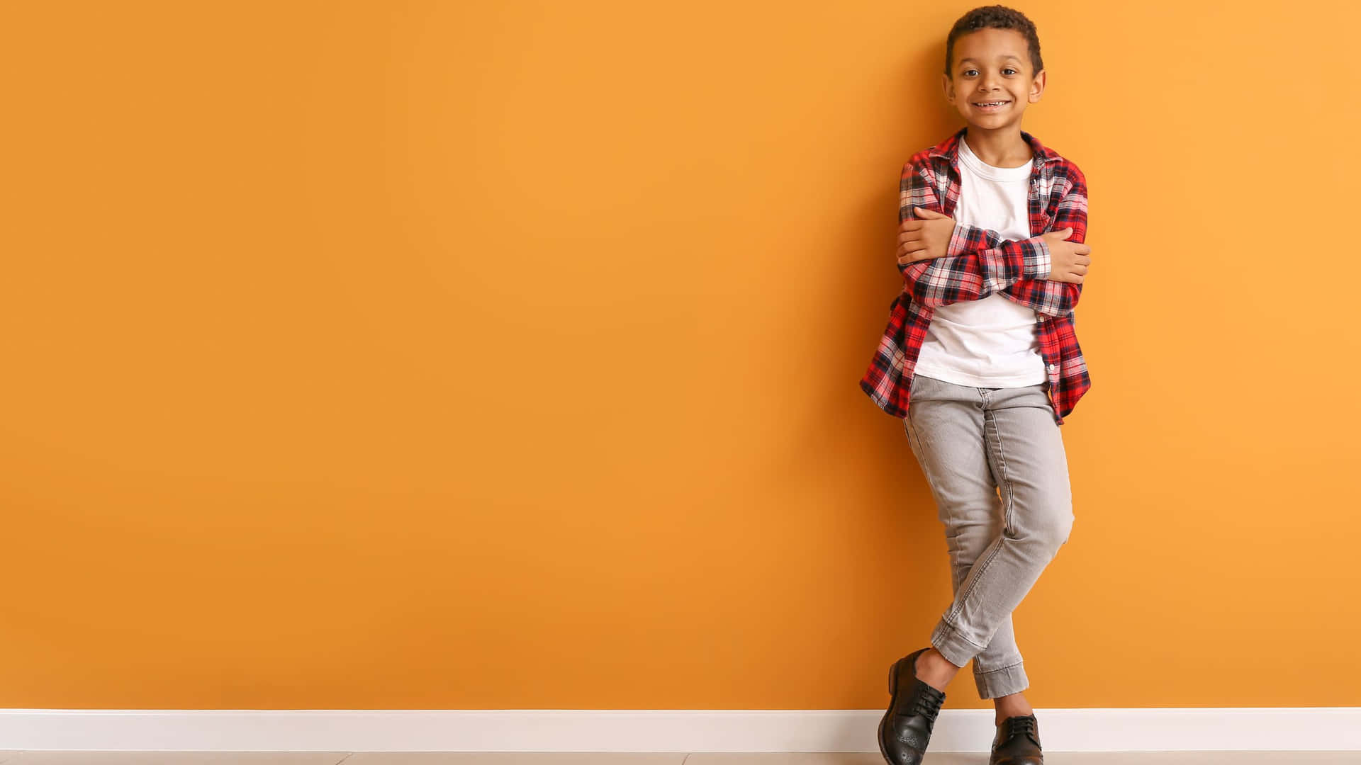 Stylish Boy On Orange Background