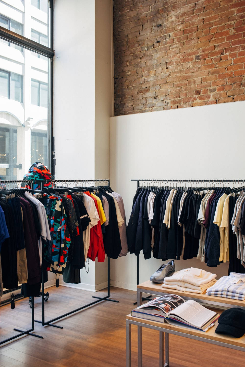 Stylish Clothing Store With Brick Wall Background