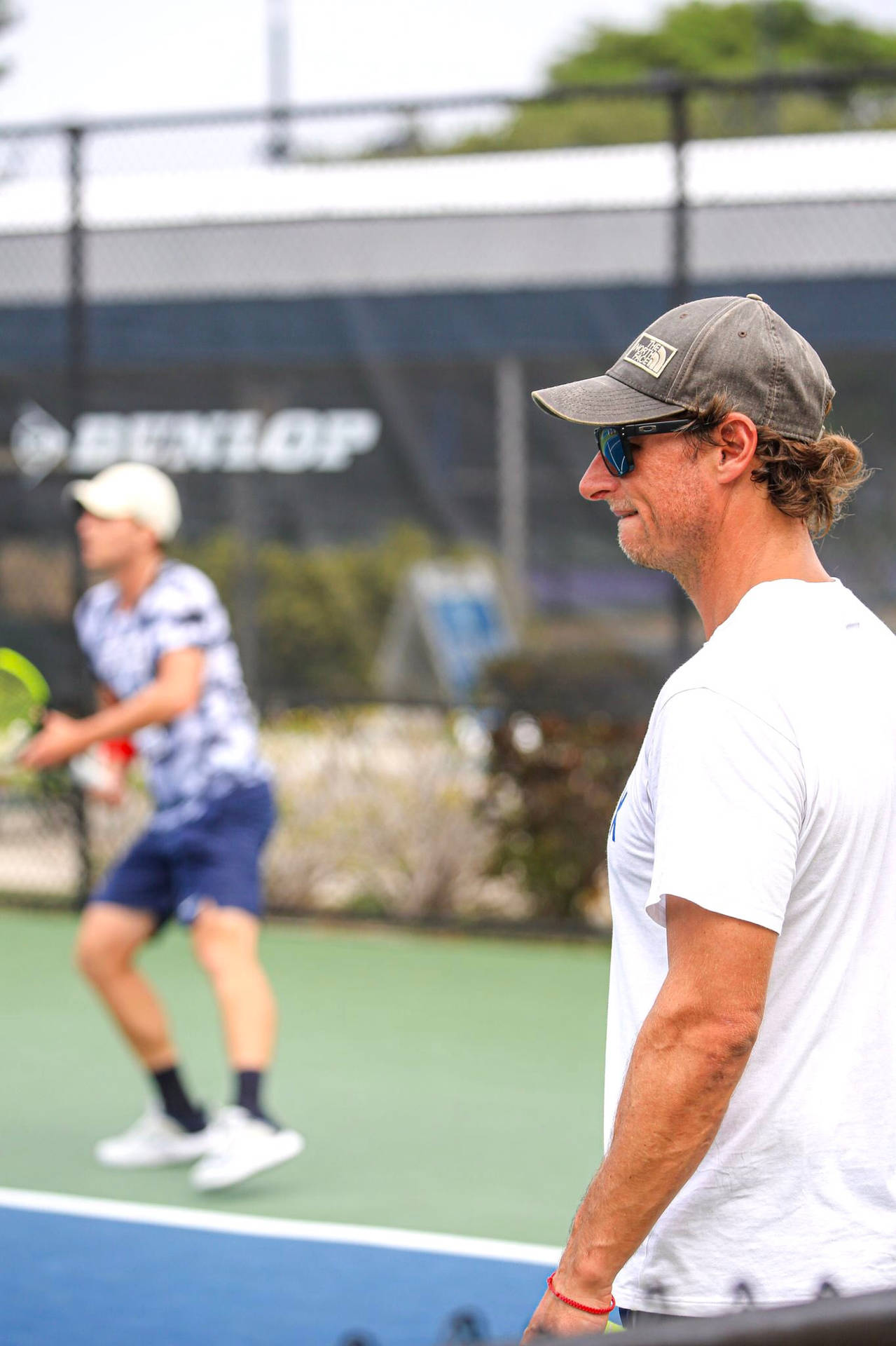 Stylish David Nalbandian Donning Cap And Sunglasses Background