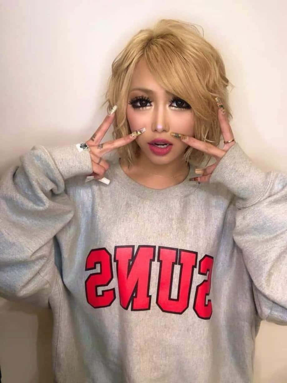 Stylish Gyaru Girl In Vibrant Shibuya Street Background