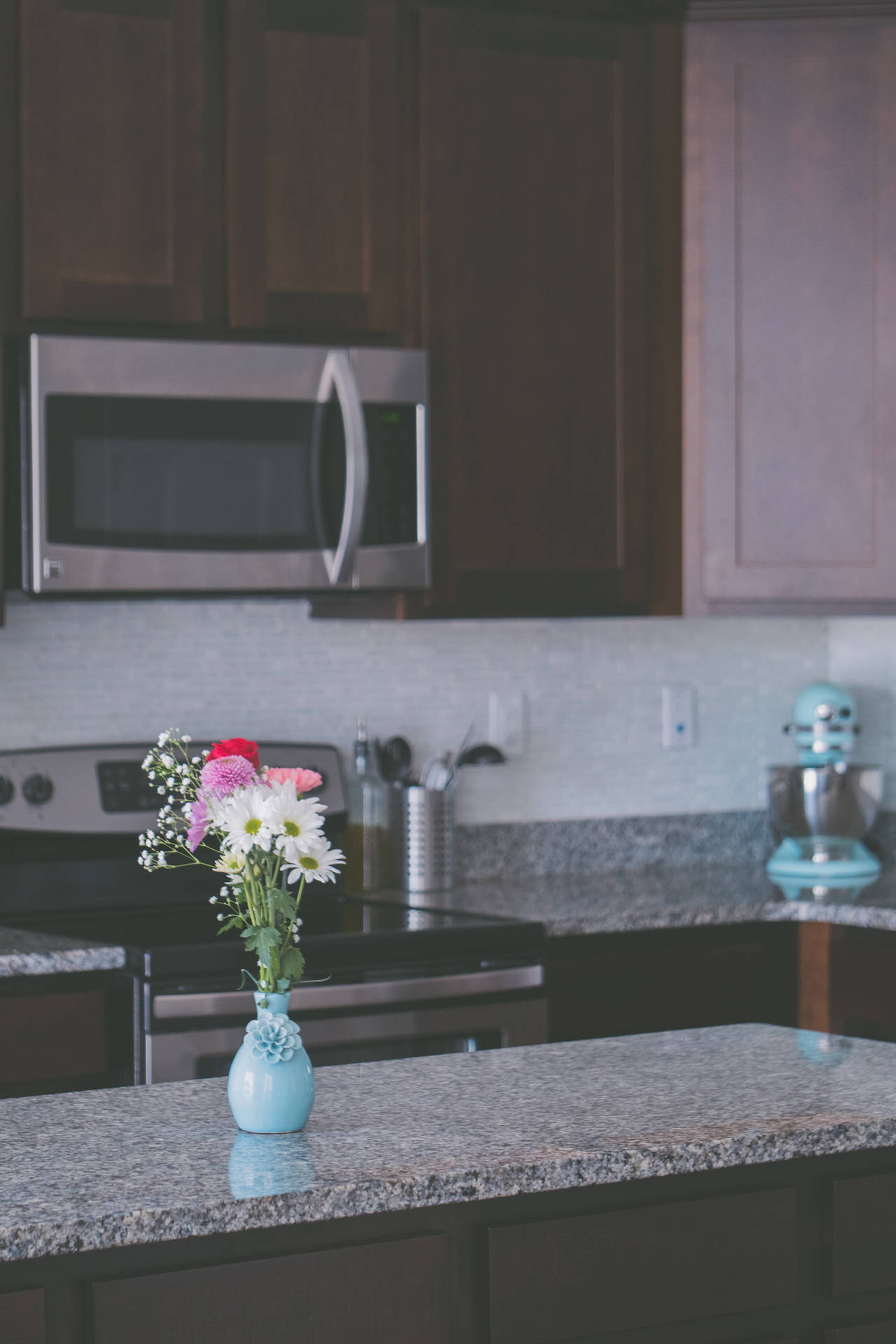 Stylish Kitchen Design With An Aesthetic Flower Vase On A Grey Marble Countertop Background