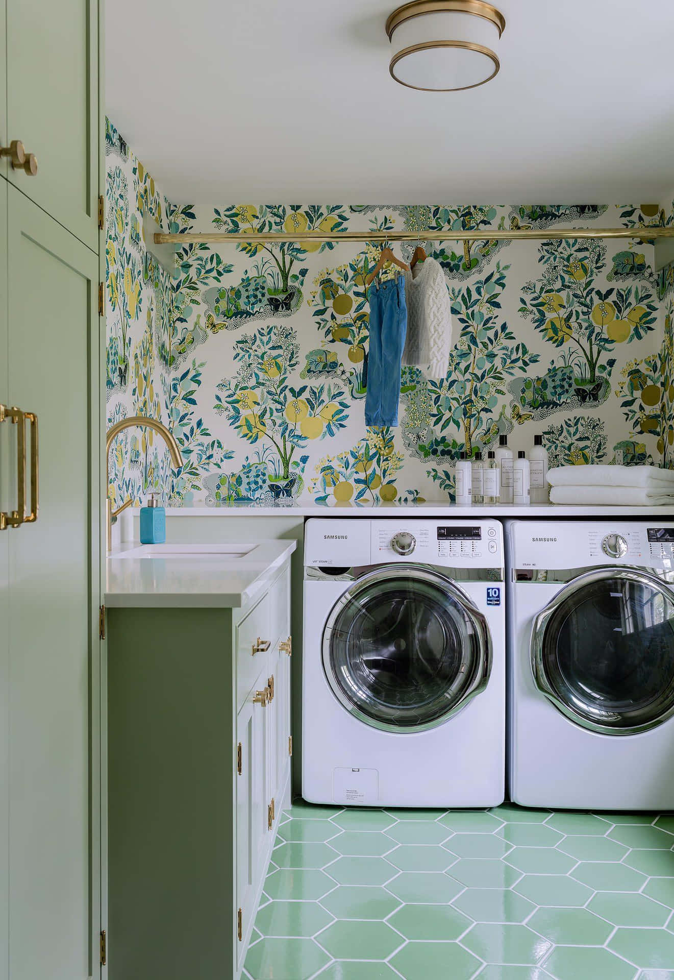 Stylish Laundry Room Interior With Washing Machines Background