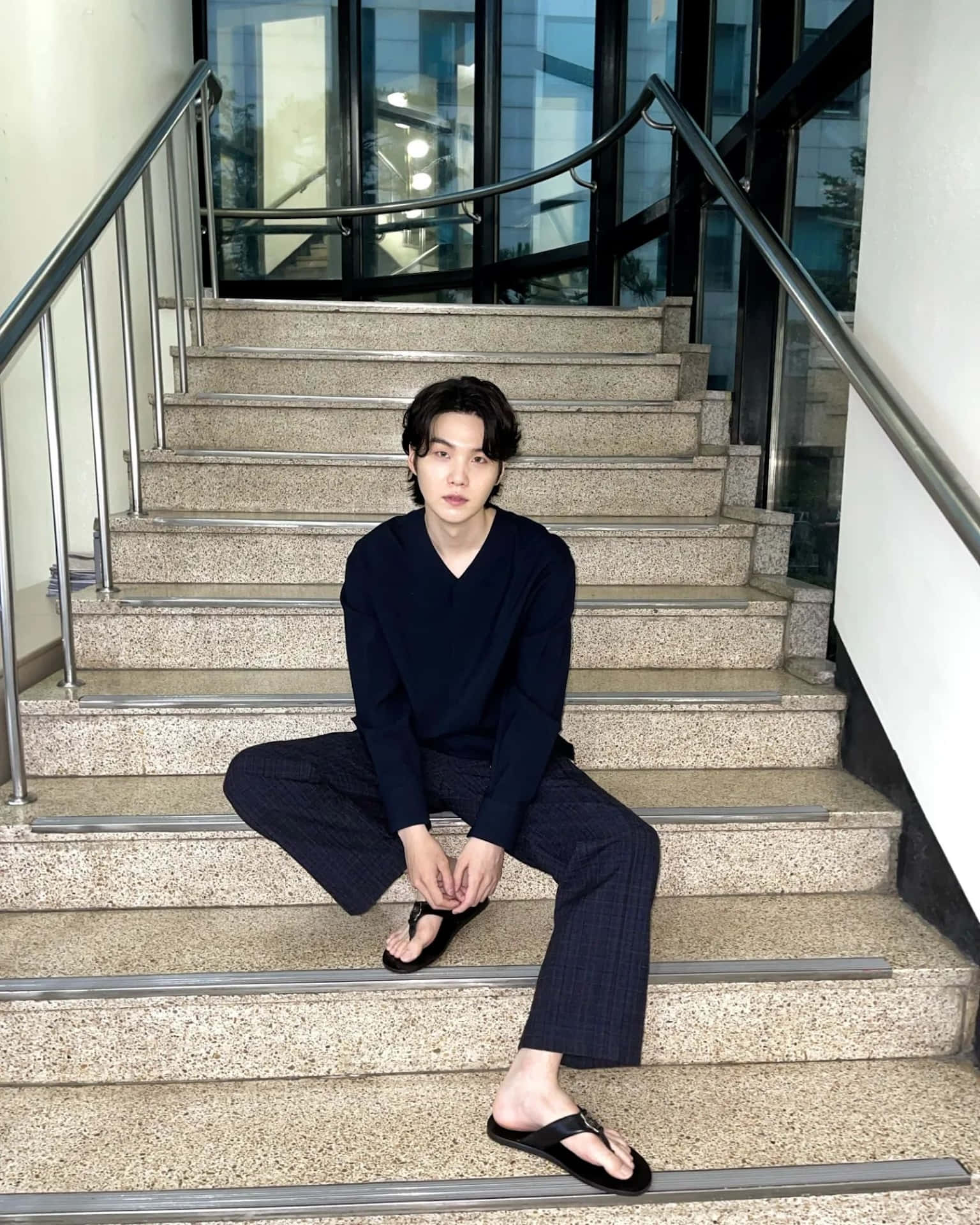 Stylish_ Man_ Sitting_on_ Stairs Background