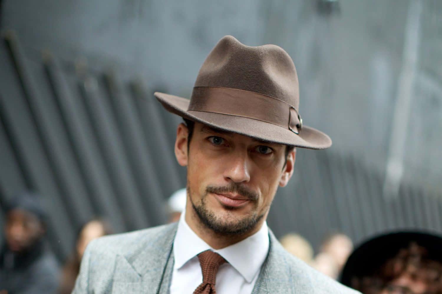 Stylish Man Wearing A Fedora Hat Background