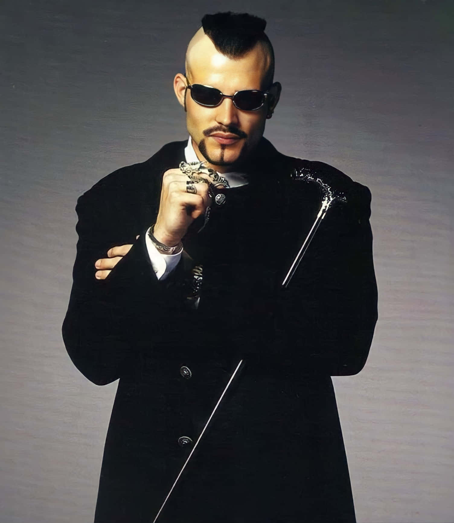 Stylish Manwith Mohawkand Sunglasses Background