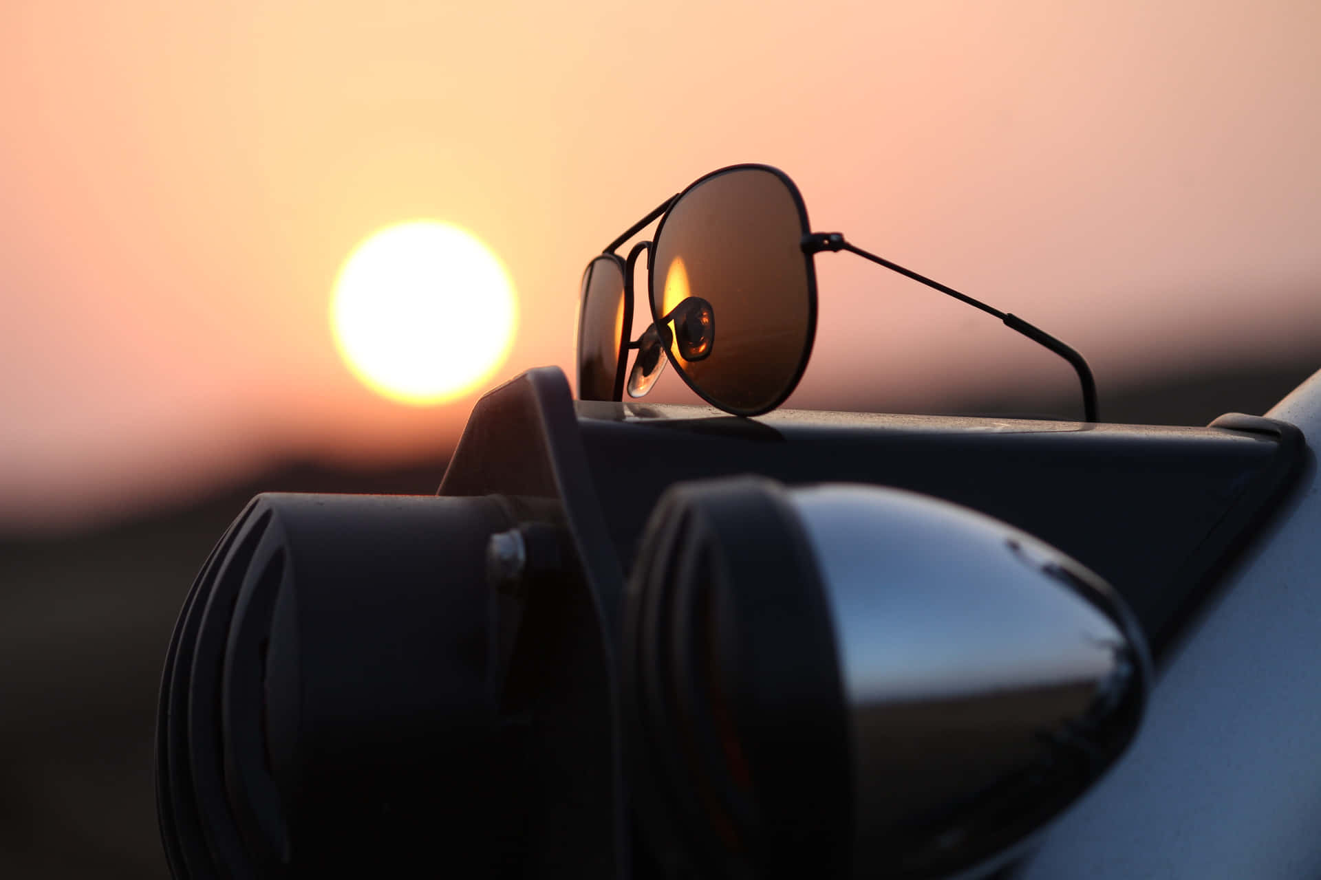 Stylish Sunglasses On A Table By The Beach Background