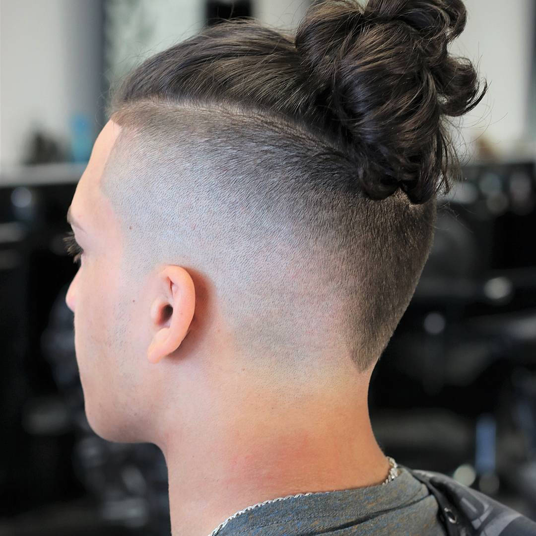 Stylish Undercut With Hair Bun For Men Background