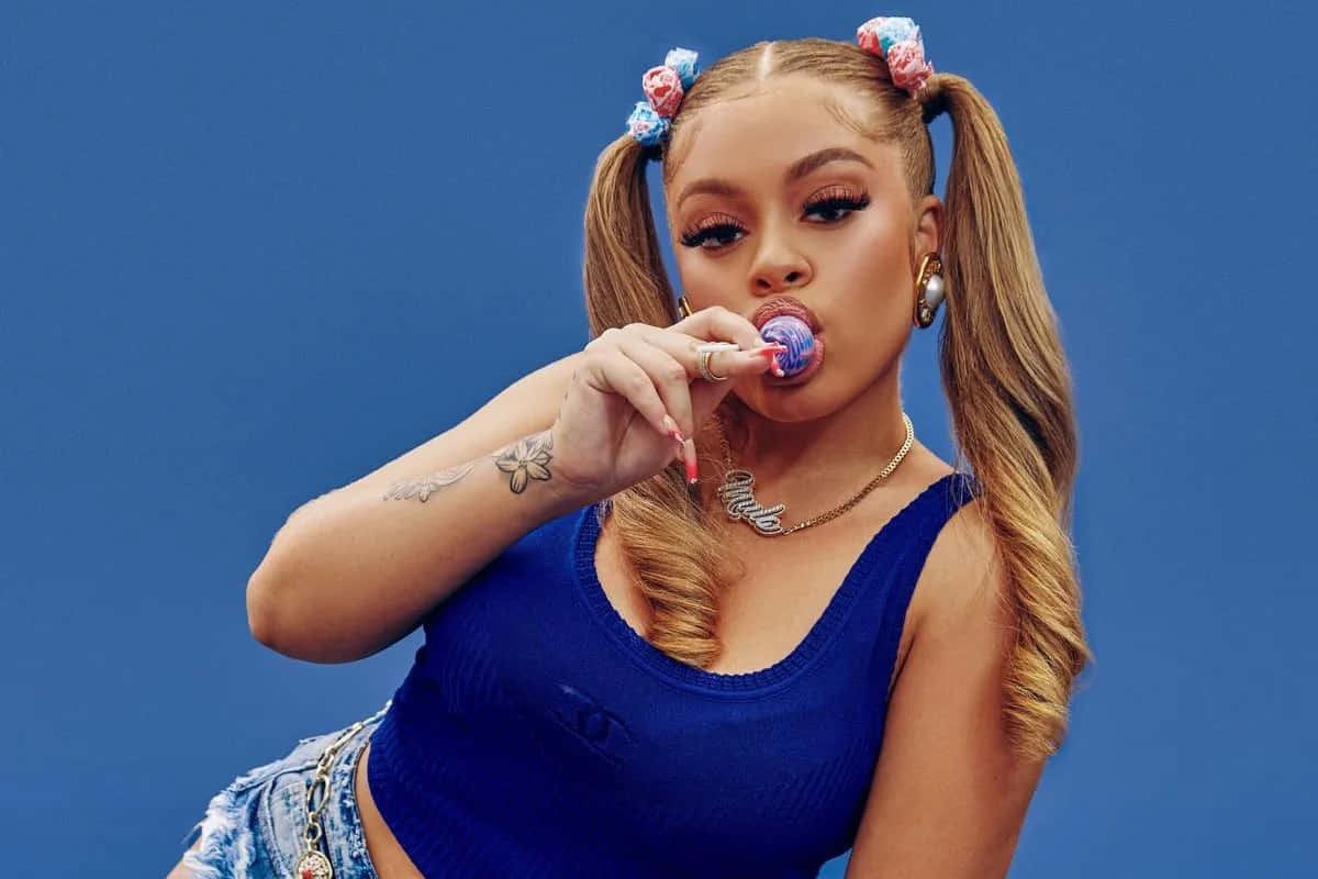 Stylish_ Woman_ Blowing_ Bubblegum Background