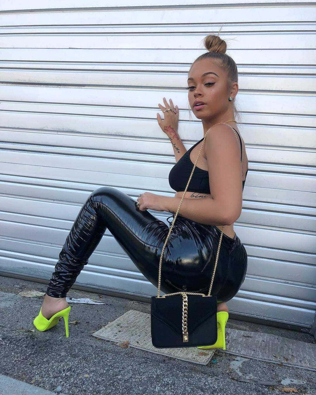 Stylish Woman Posing Against Shutter Background