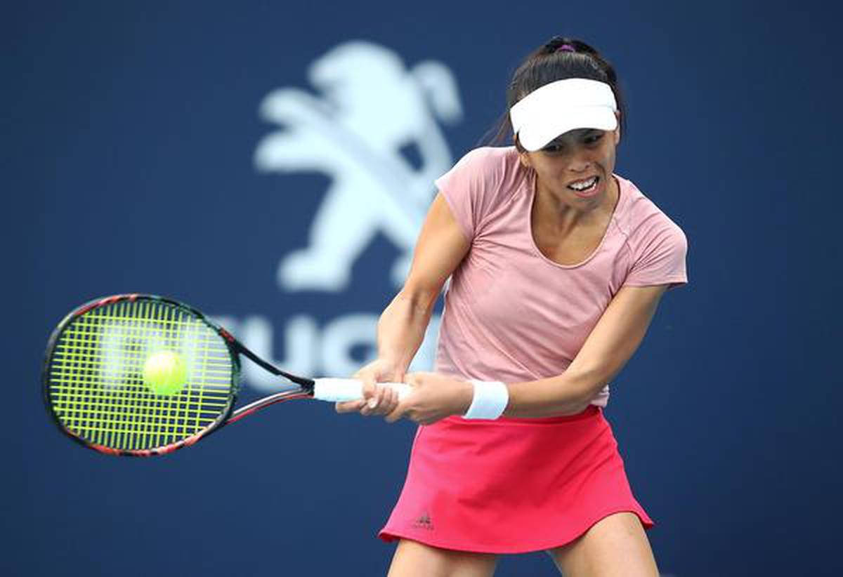 Su-wei Hsieh Swinging Her Racket Background