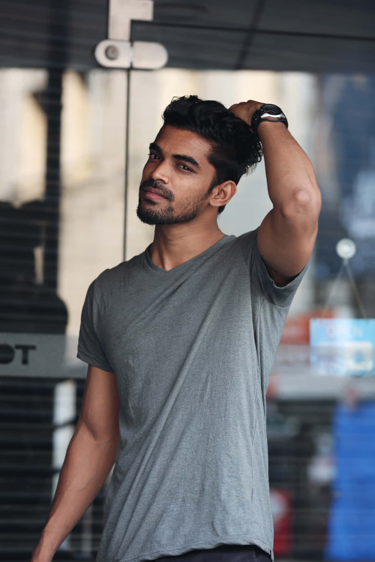 Suave Model Holding Head [wallpaper] Background