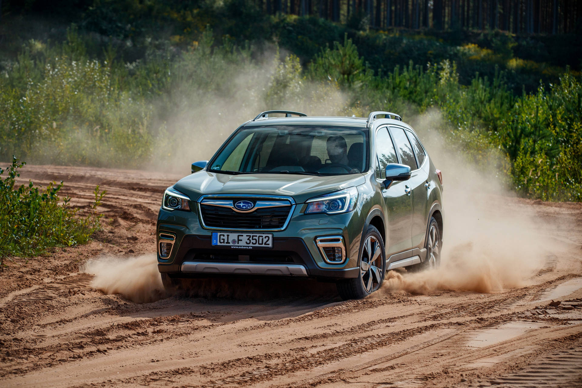 Subaru Forester Kicking Up Dust On Off-road Adventure Background