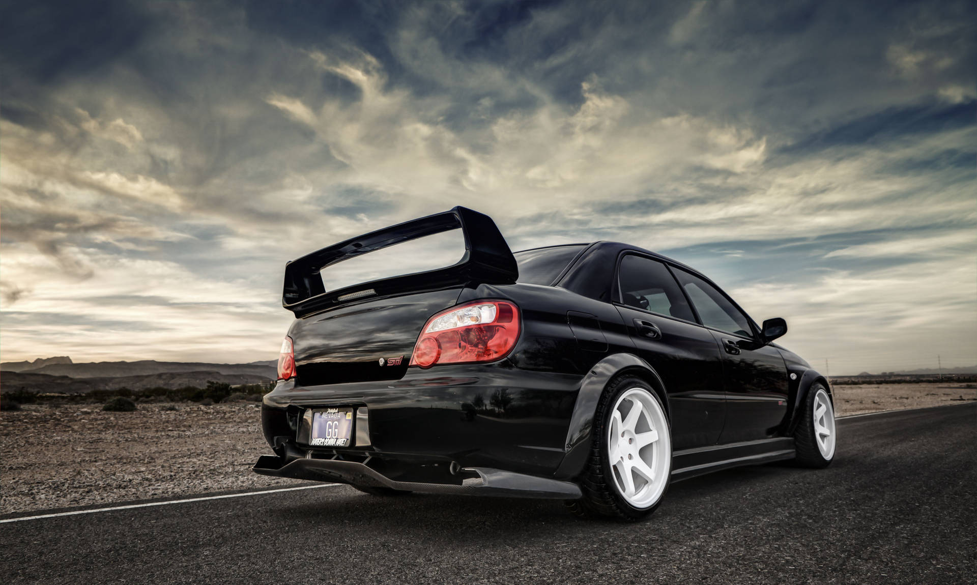 Subaru Parked On Deserted Road Background