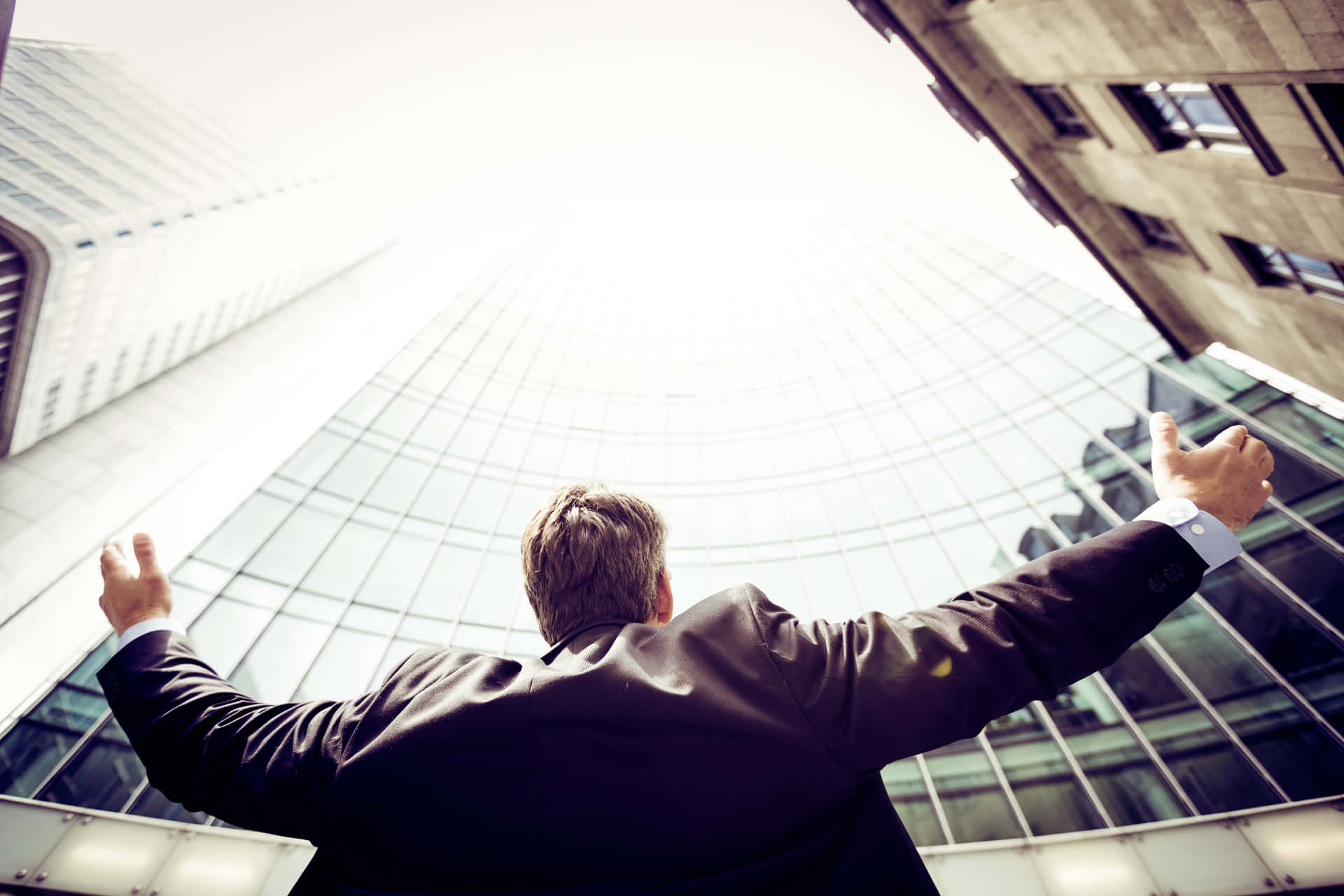 Successful Man Looking At The Buildings Background