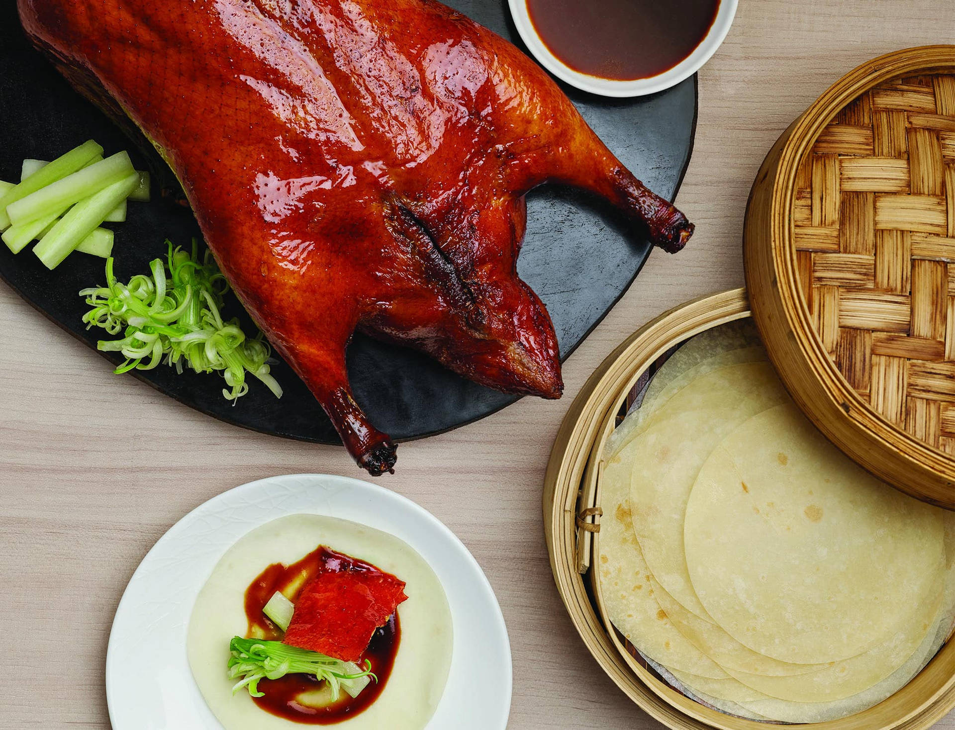 Succulent Roasted Peking Duck Served On A Stylish Black Platter Background