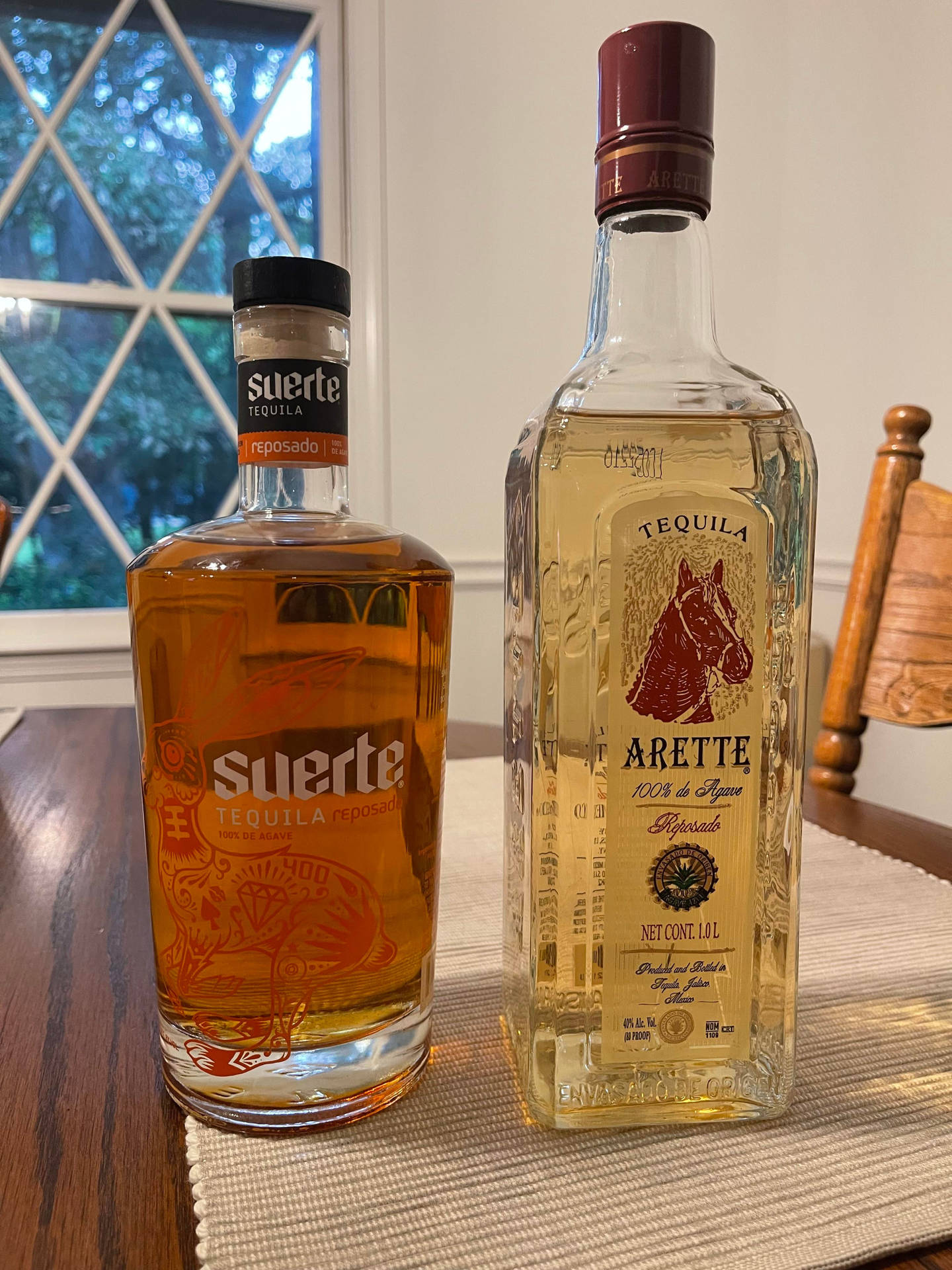 Suerte And Arette Tequila Bottles Background