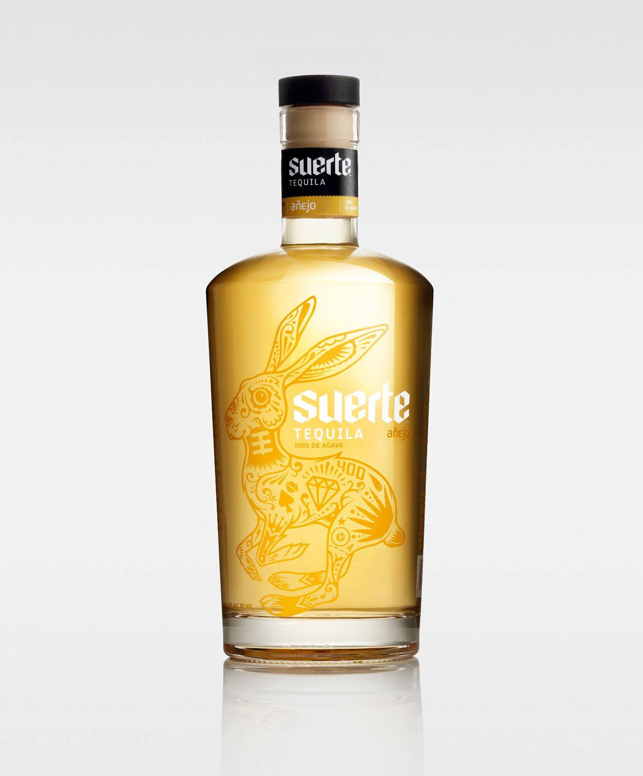 Suerte Anejo Extra Gold Tequila Background