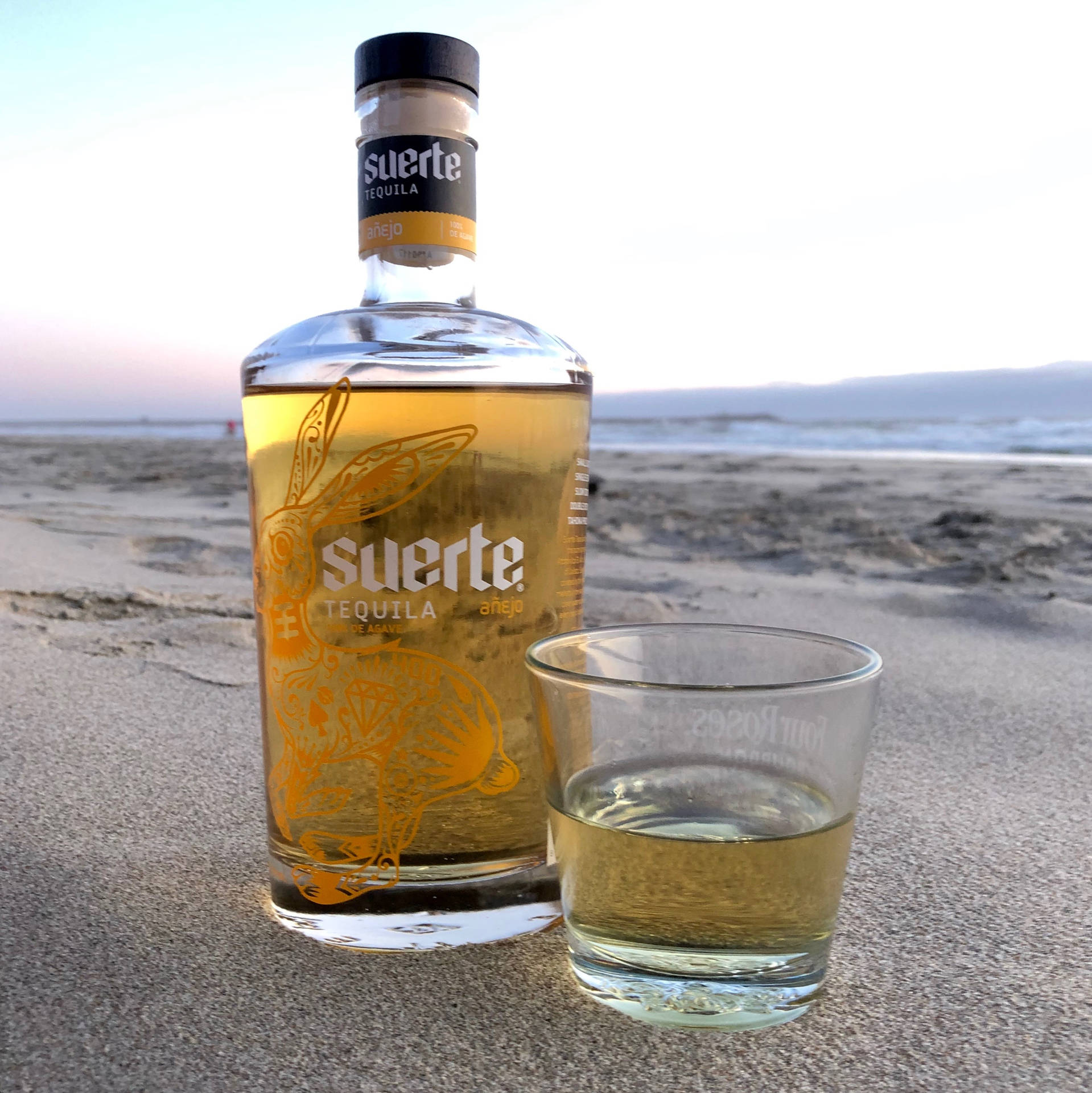 Suerte Gold Anejo Tequila Background